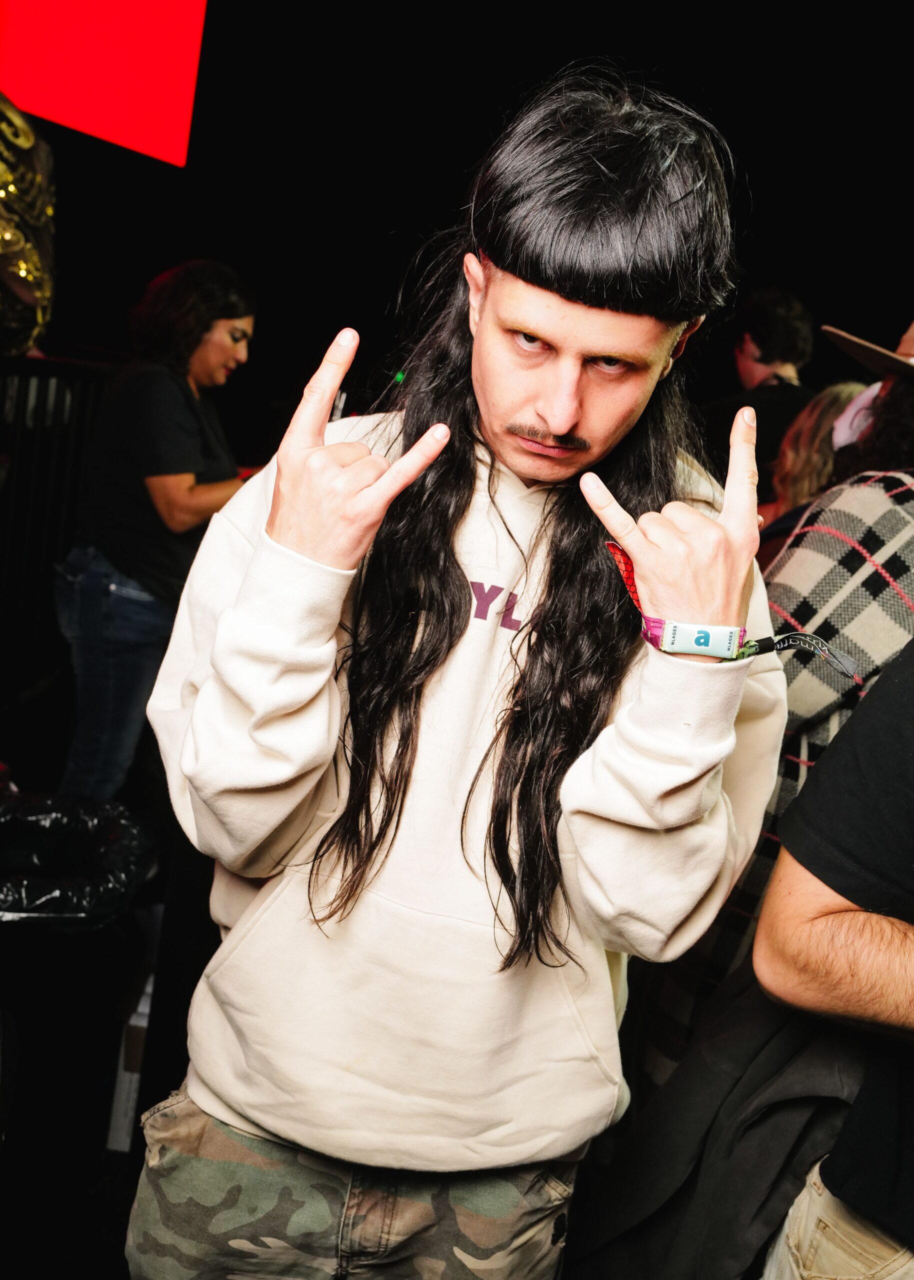 Oliver Tree holding up rock and roll hand signs