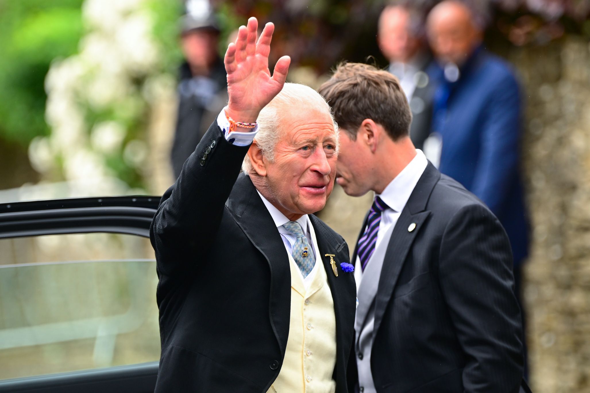King Charles waving at Peter Phillips wedding