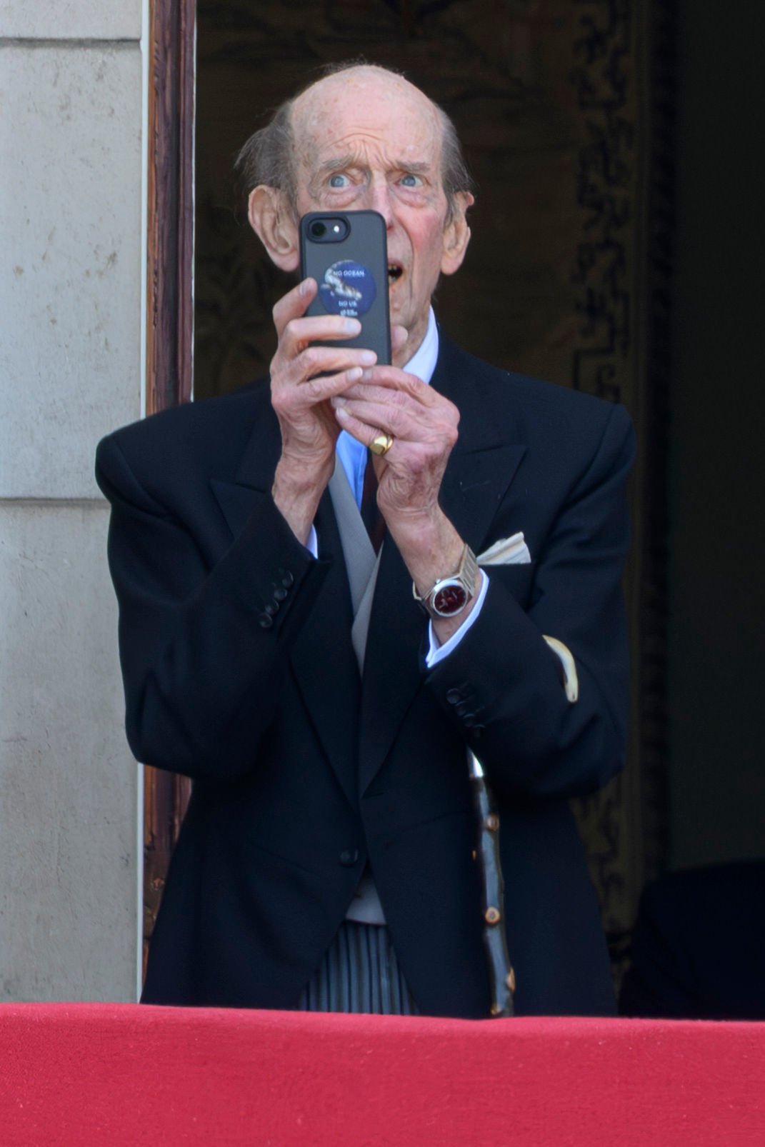 Duke of Kent holding his phone at Trooping the Colour