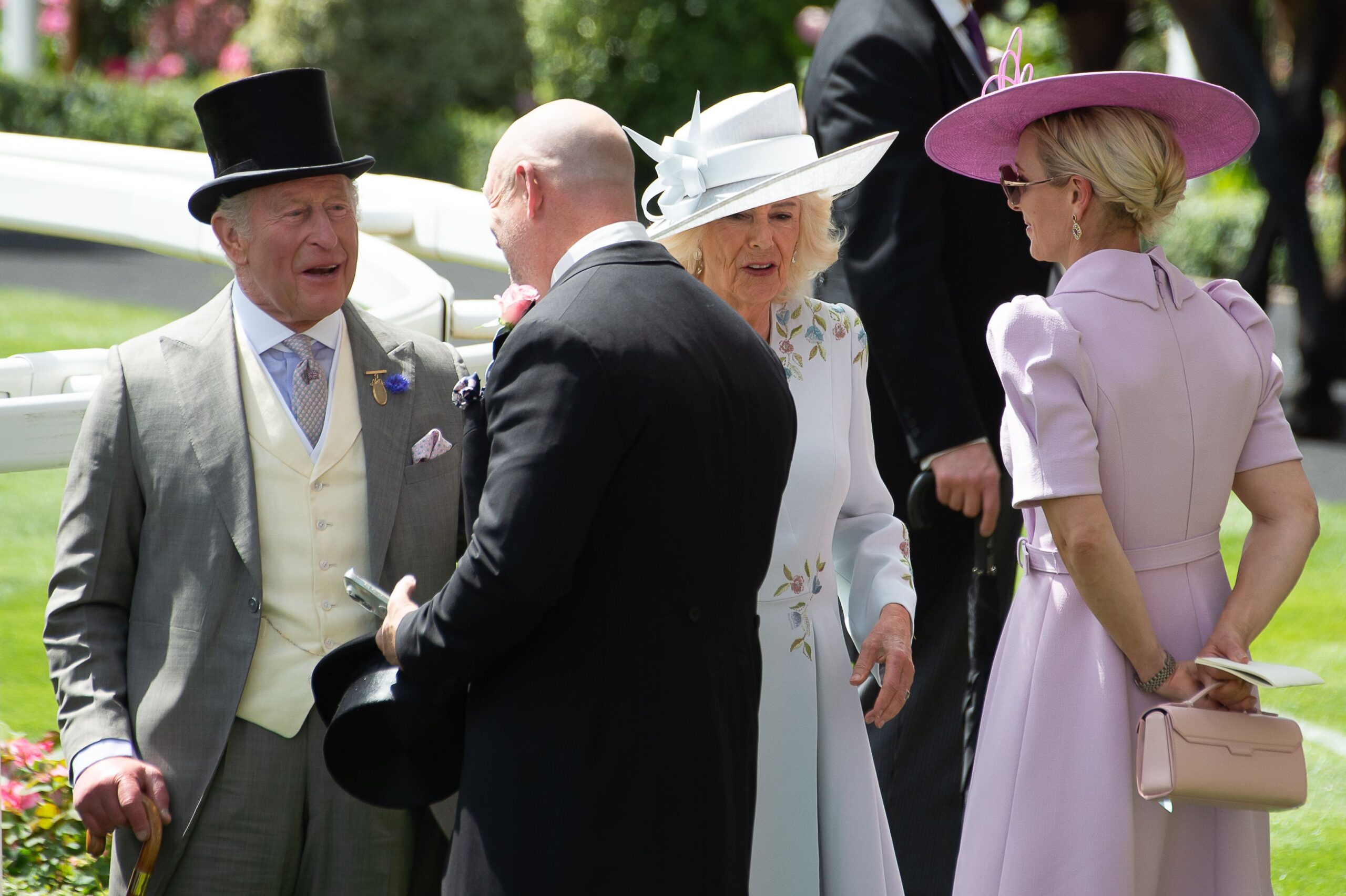 Mike and Zara Tindall speaking to King Charles at Royal Ascot