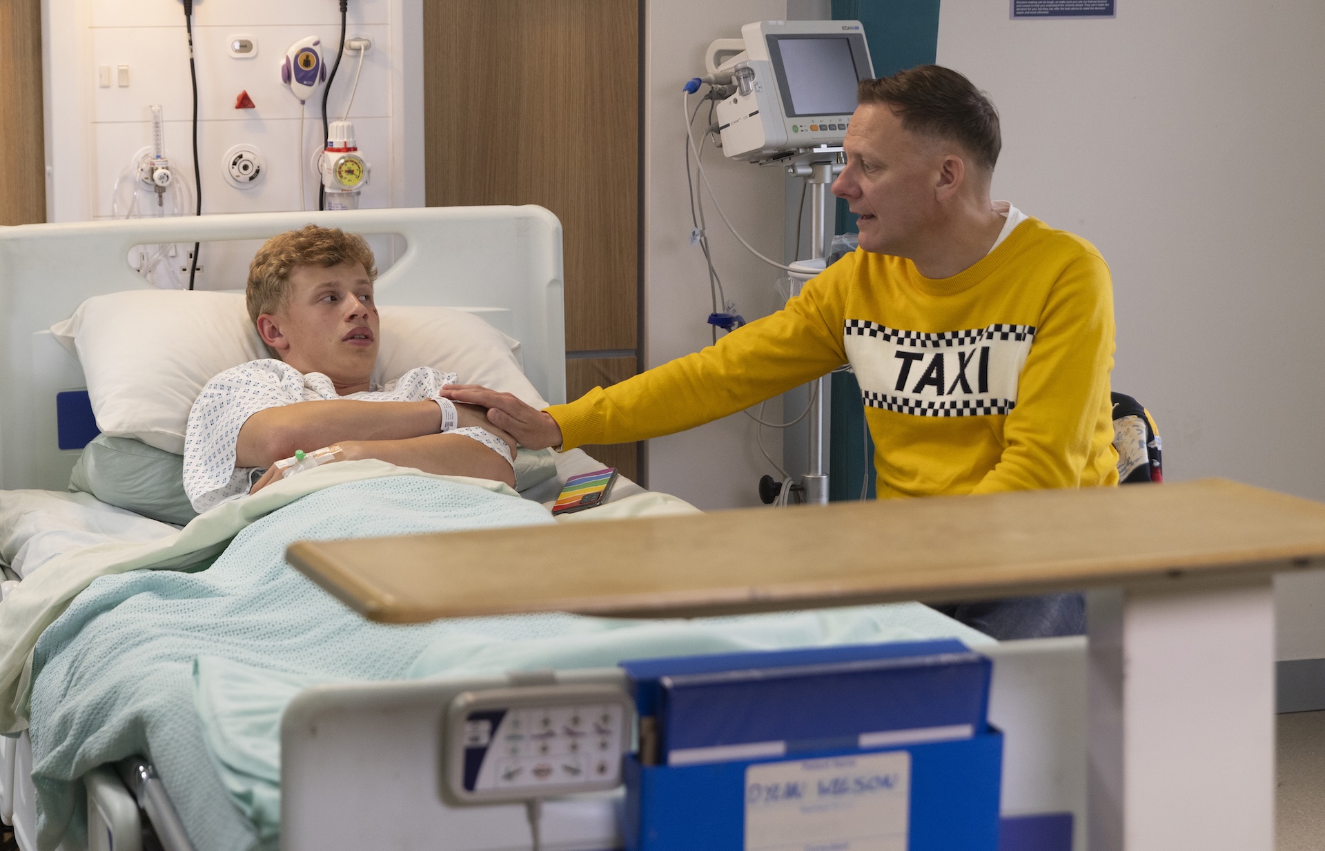 Sean tending to Dylan at the hospital