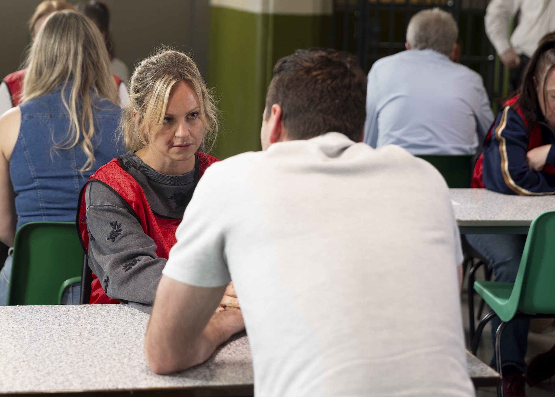 Sarah talking to Kit at the prison in Coronation Street