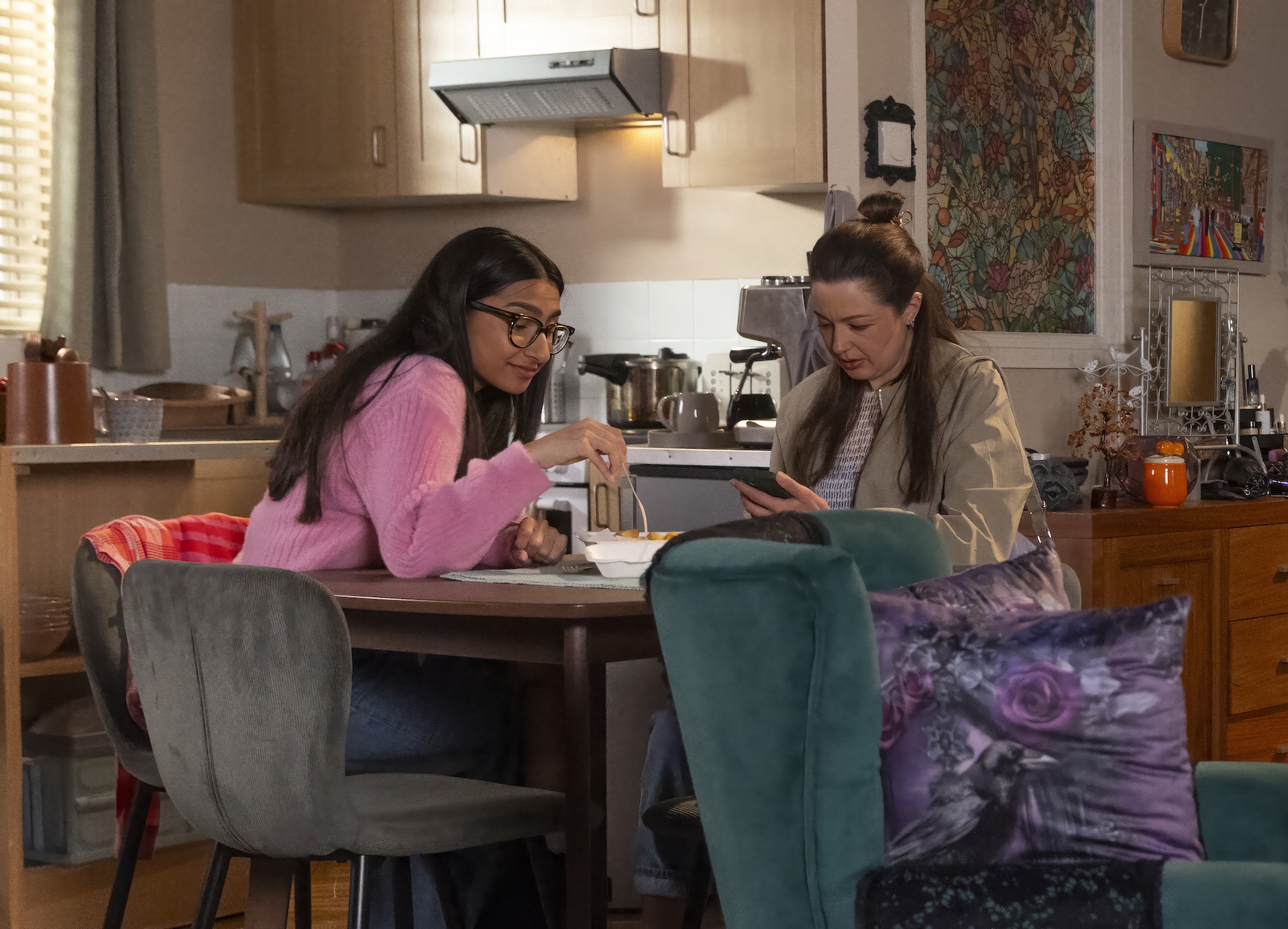 Asha and Sienna at the table in Coronation Street
