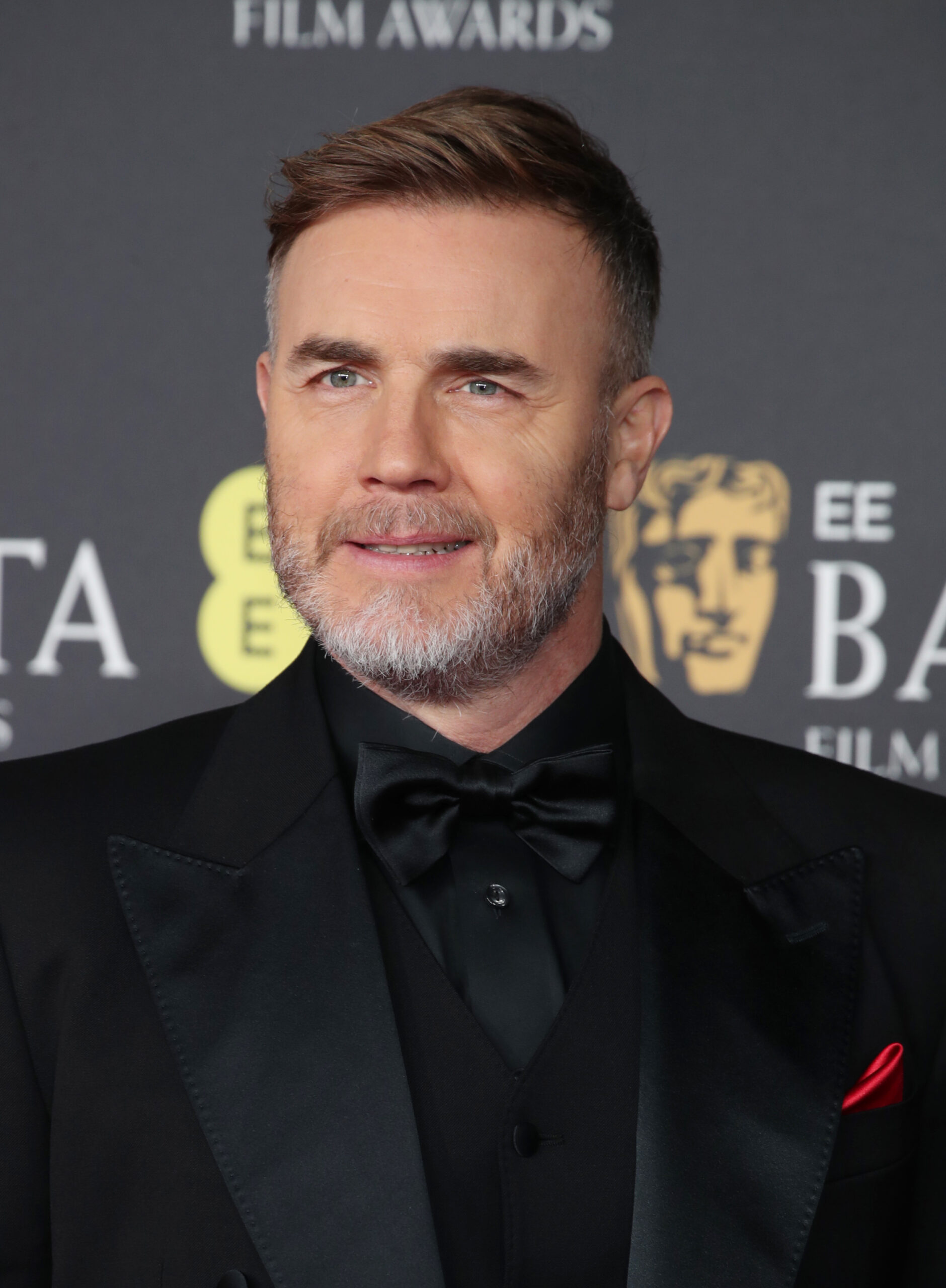 Gary Barlow smiling at the 78th British Academy Film Awards