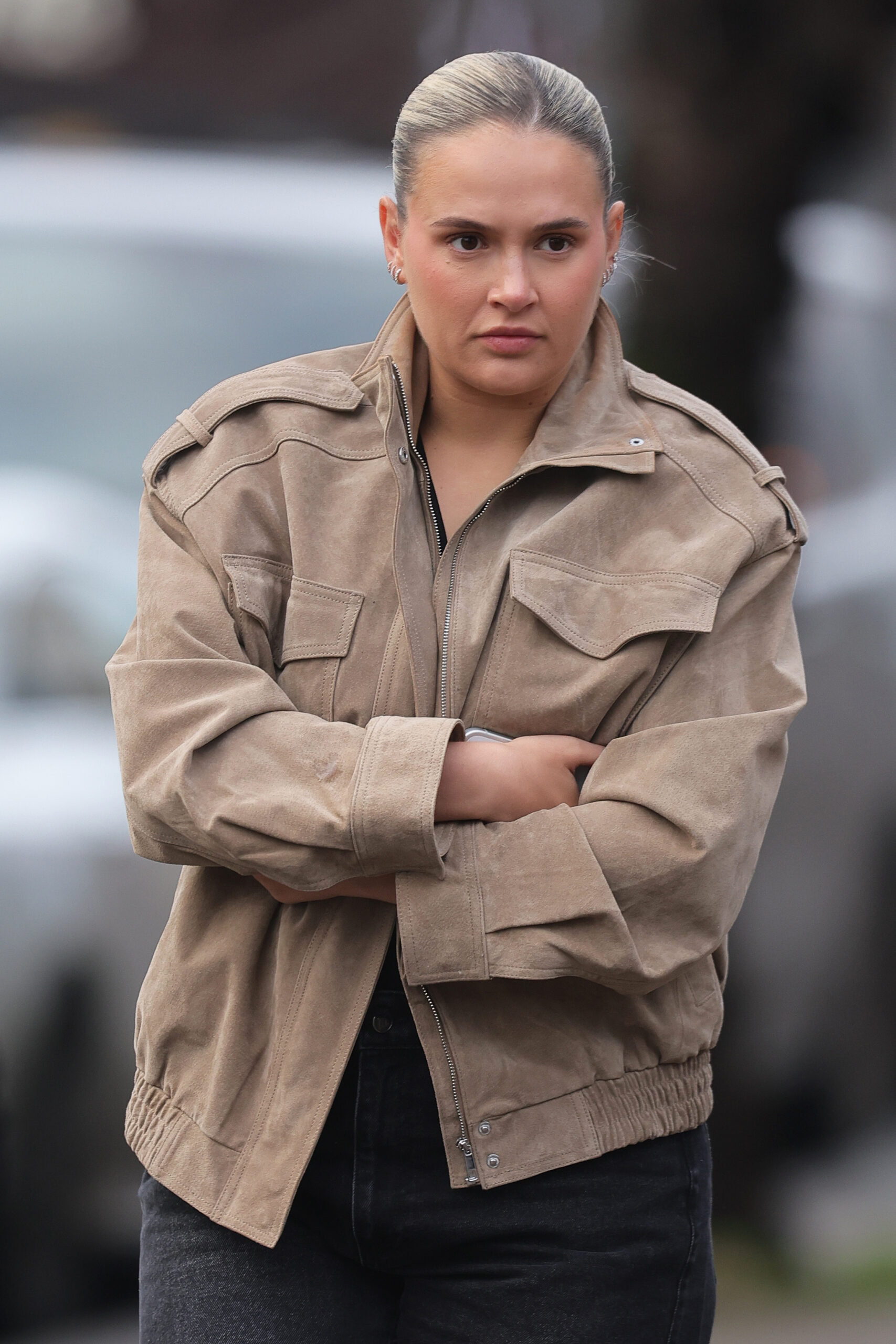 Molly-Mae Hague with folded arms frowning as she walks