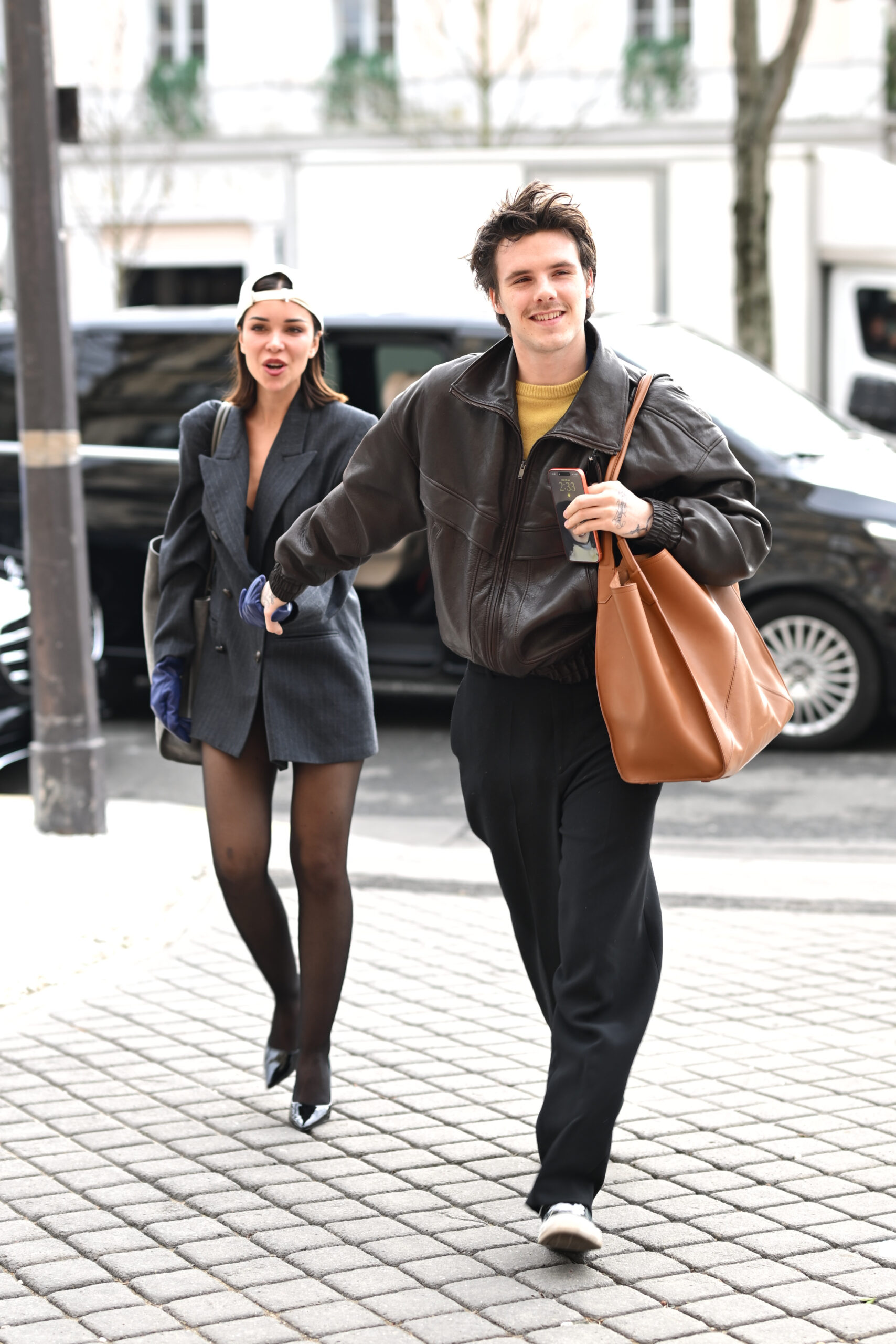 Cruz Beckham walking with his girlfriend
