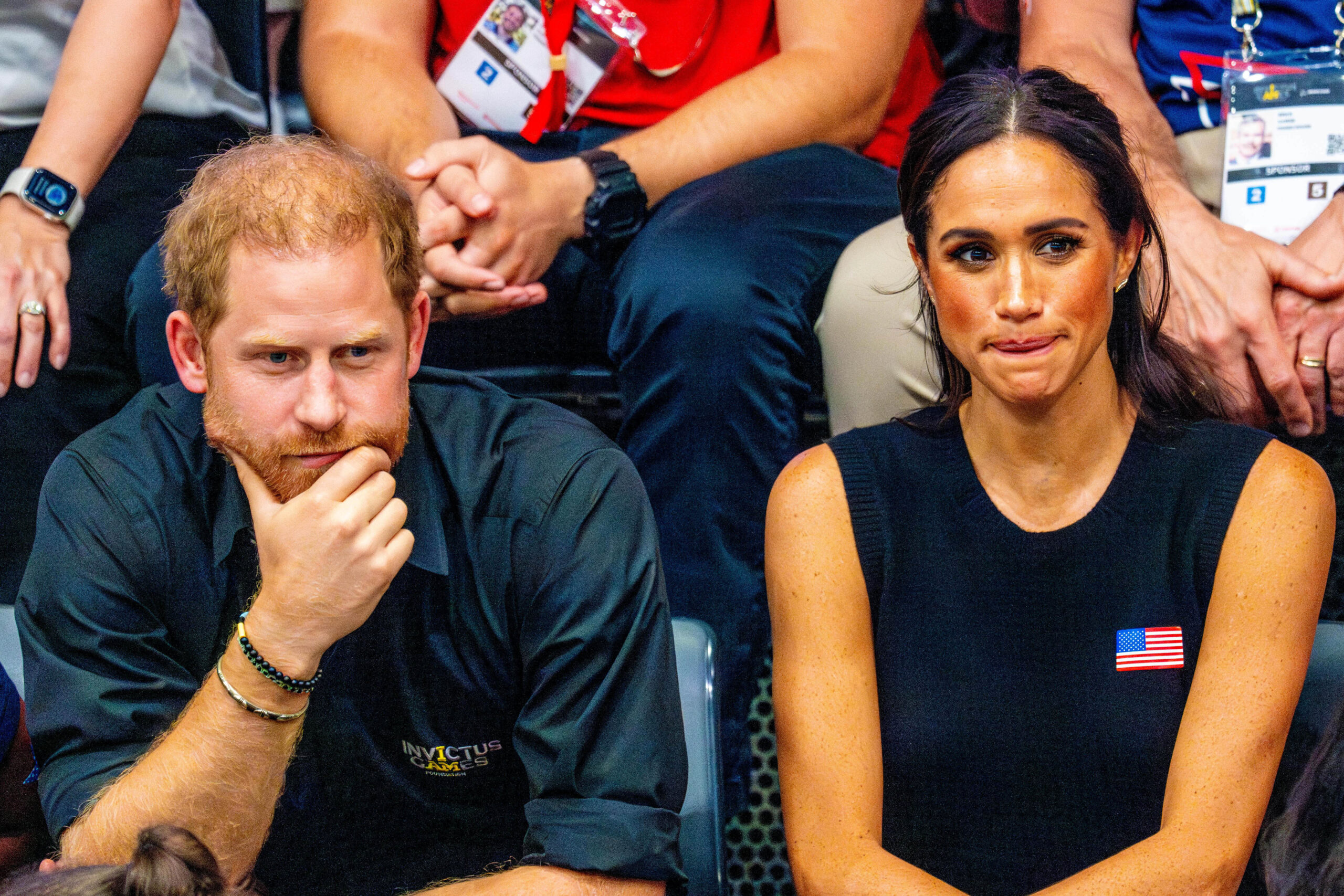 Harry and Meghan frowning