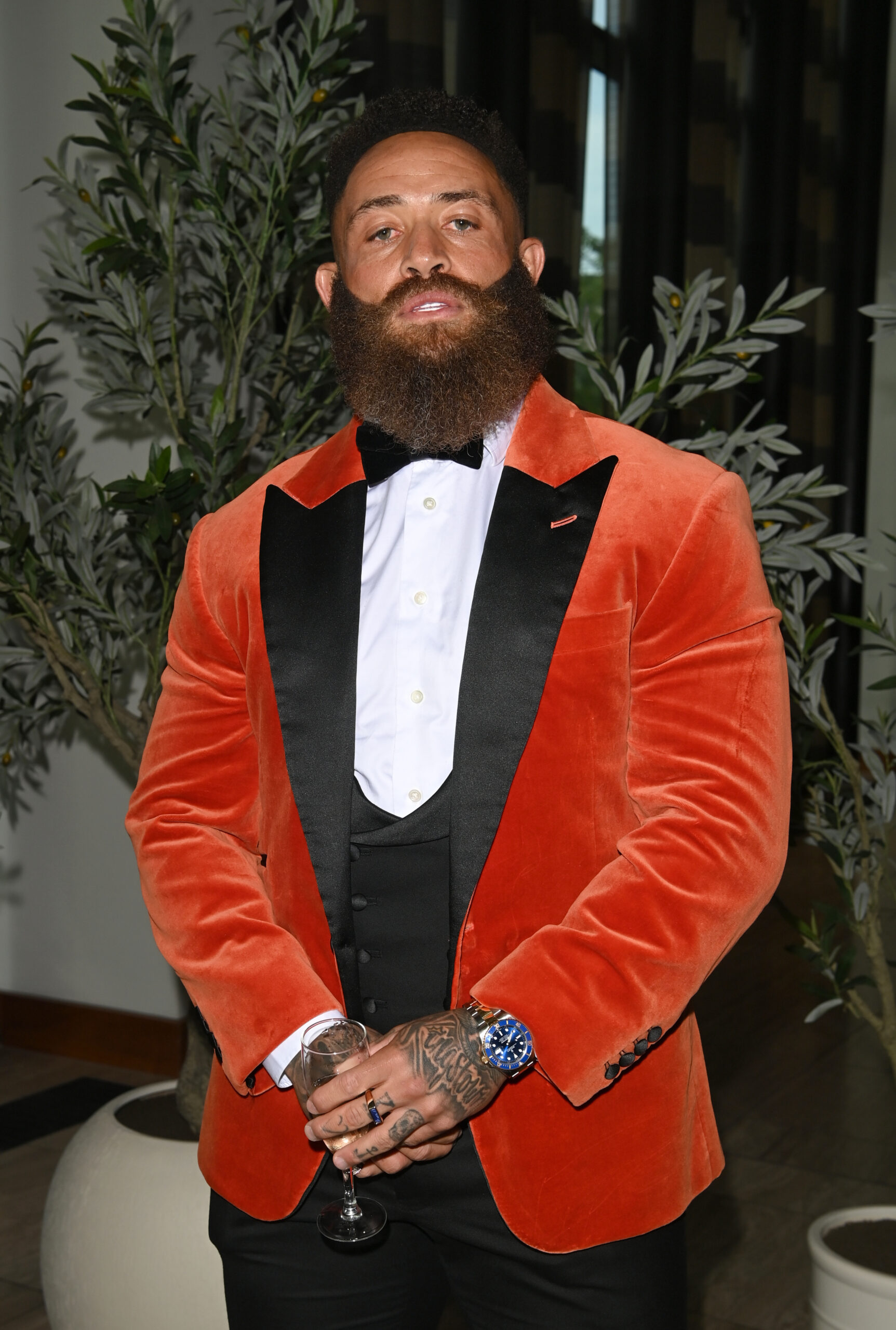 Ashley Cain in red blazer at event