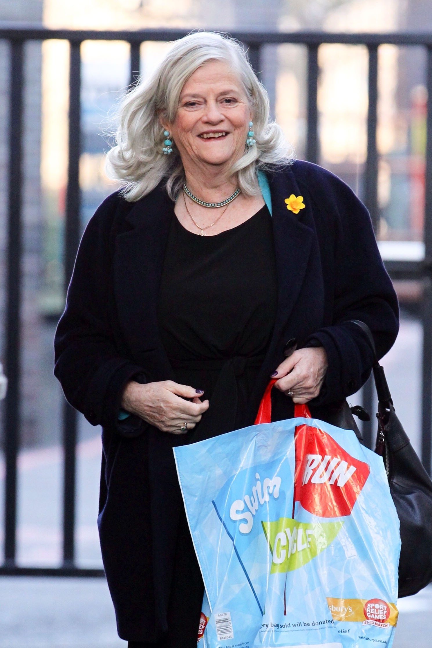 Ann Widdecombe smiling and walking