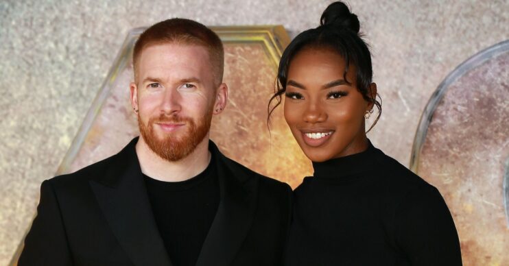 Strictly star Neil Jones and Chyna Mills smiling at event