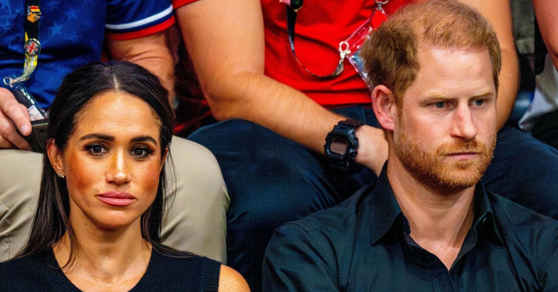 Meghan Markle and Prince Harry frowning