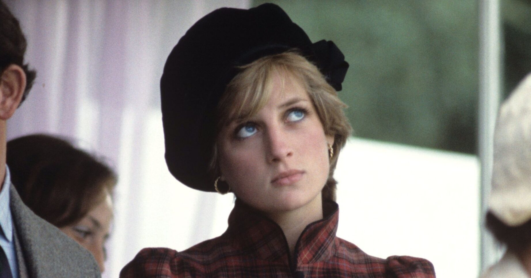 Princess Diana looking up and frowning