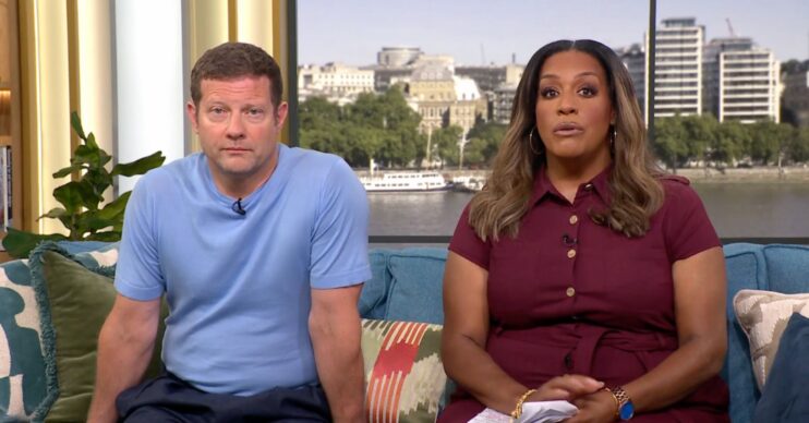 Dermot blue t shirt and Alison in a dark red blouse