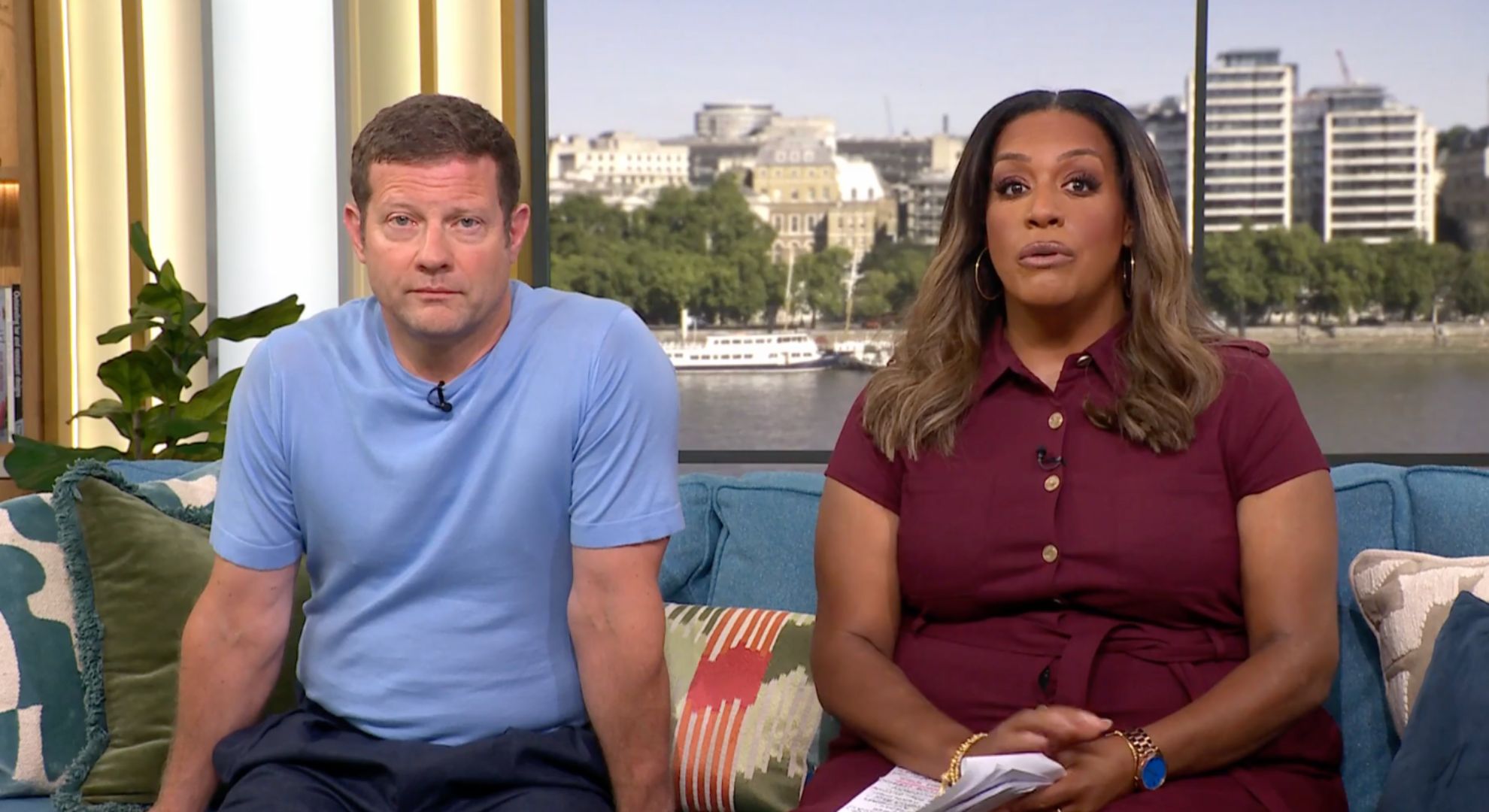 Dermot blue t shirt and Alison in a dark red blouse