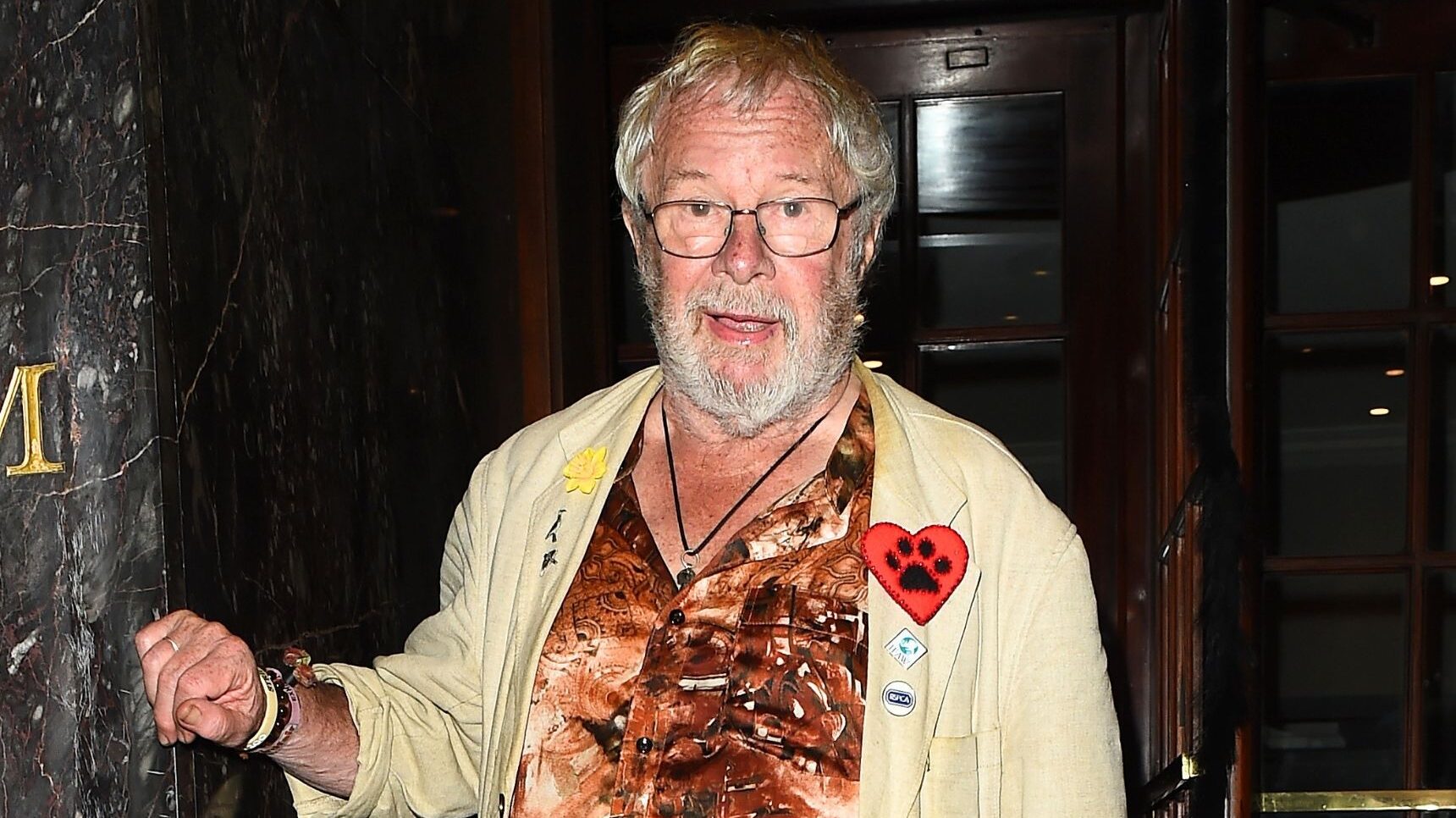 Bill Oddie in brown shirt and yellow jacket