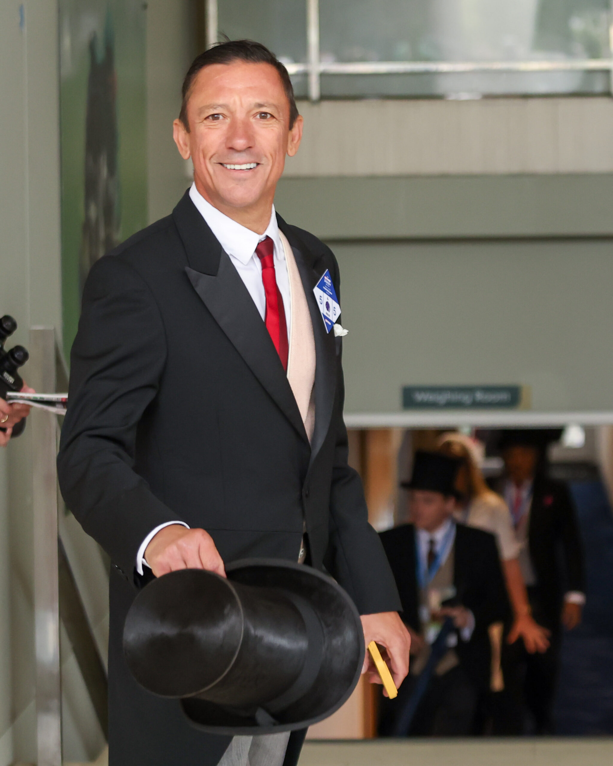 Frankie Dettori smiling wearing a suit