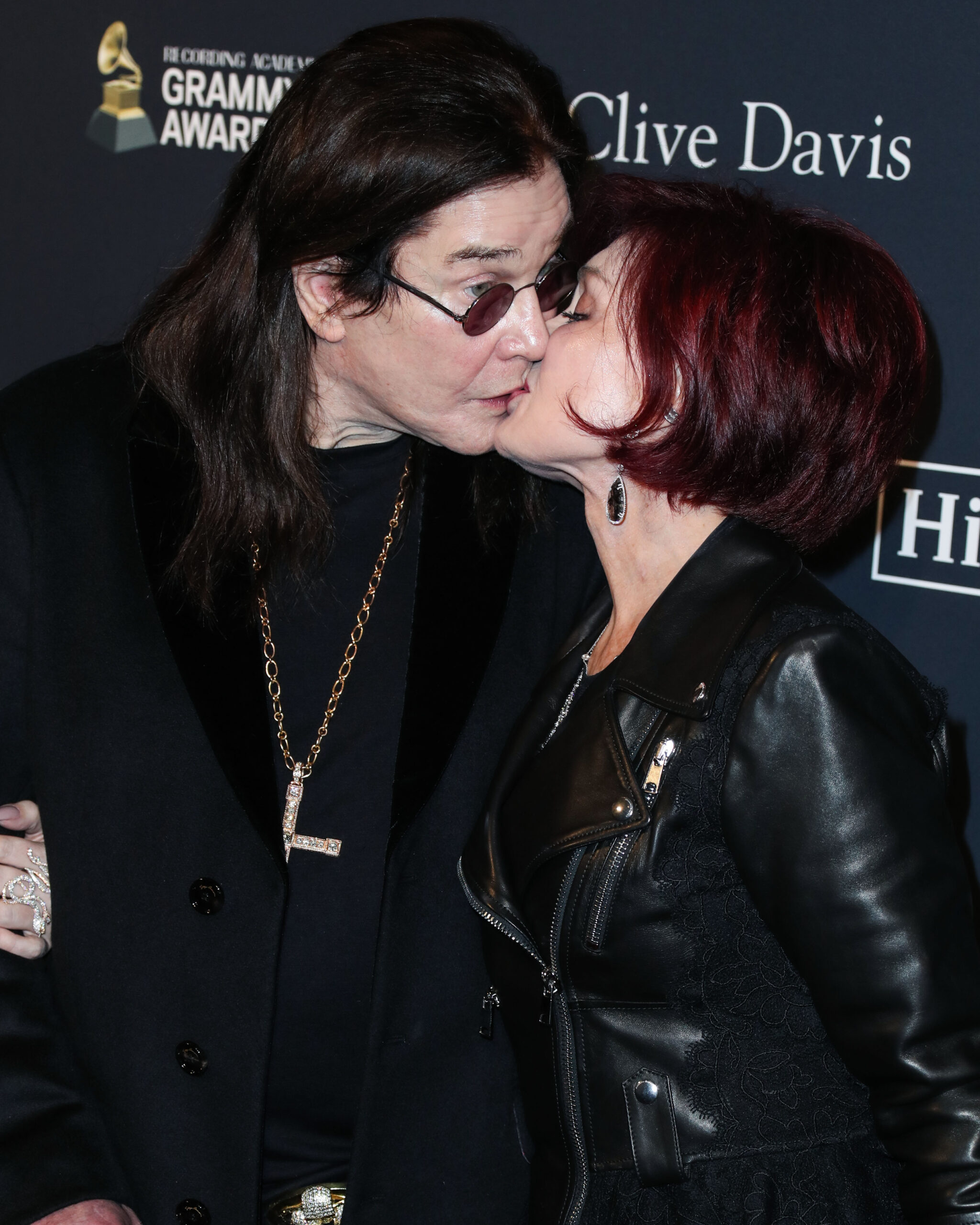 Ozzy and Sharon Osbourne kissing at event