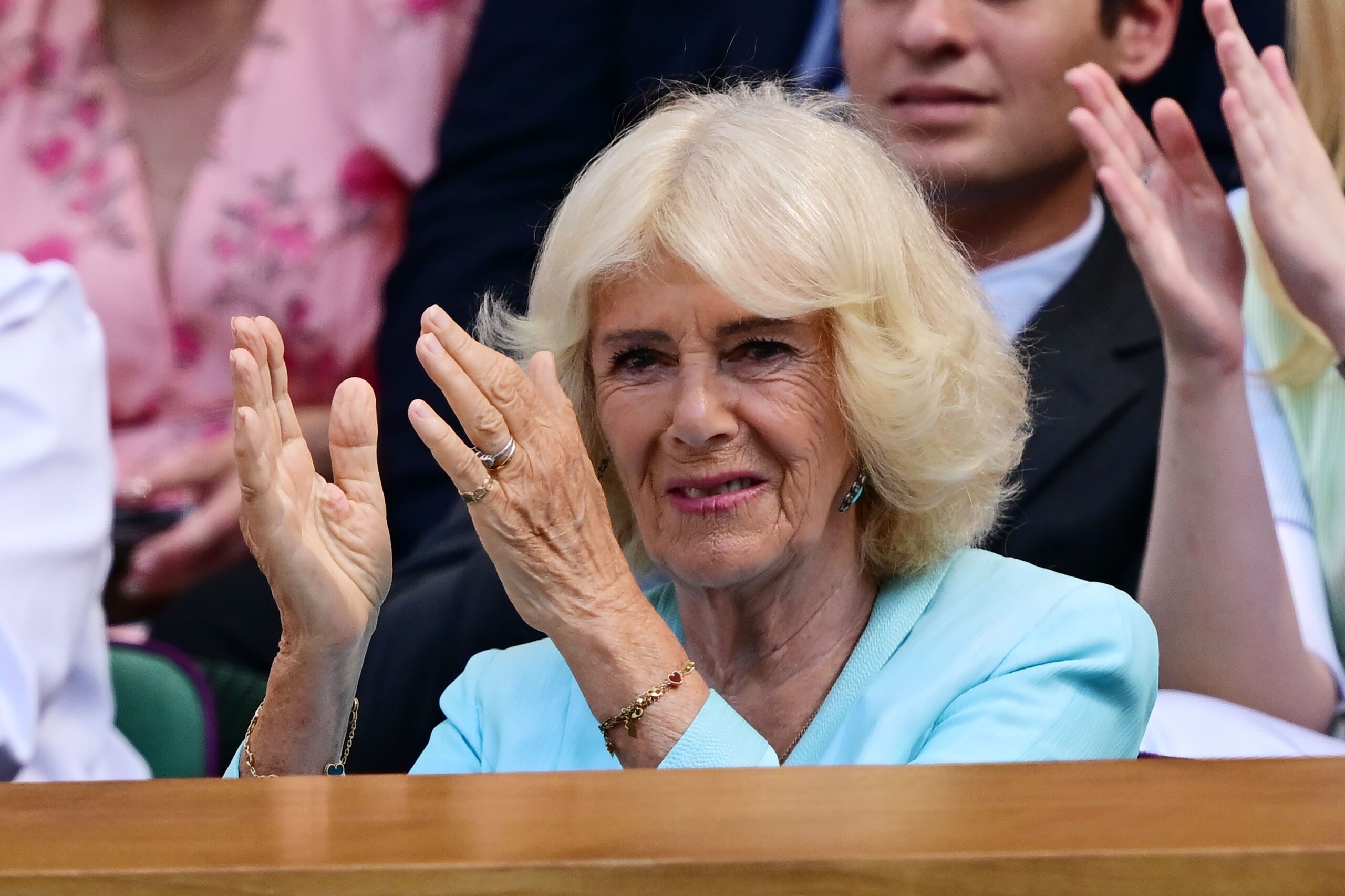 Queen Camilla clapping her hands at Wimbledon
