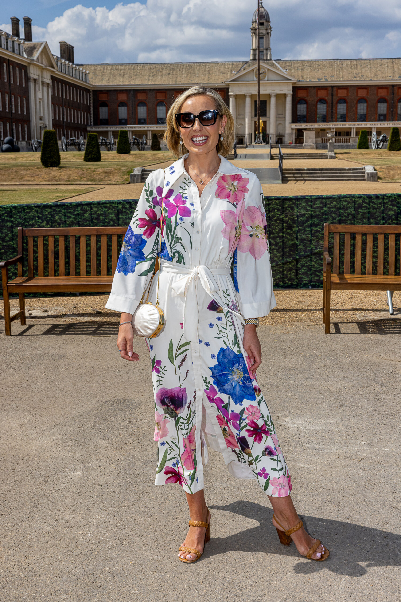 Amy Dowden wearing a floral jumpsuit and sunglasses