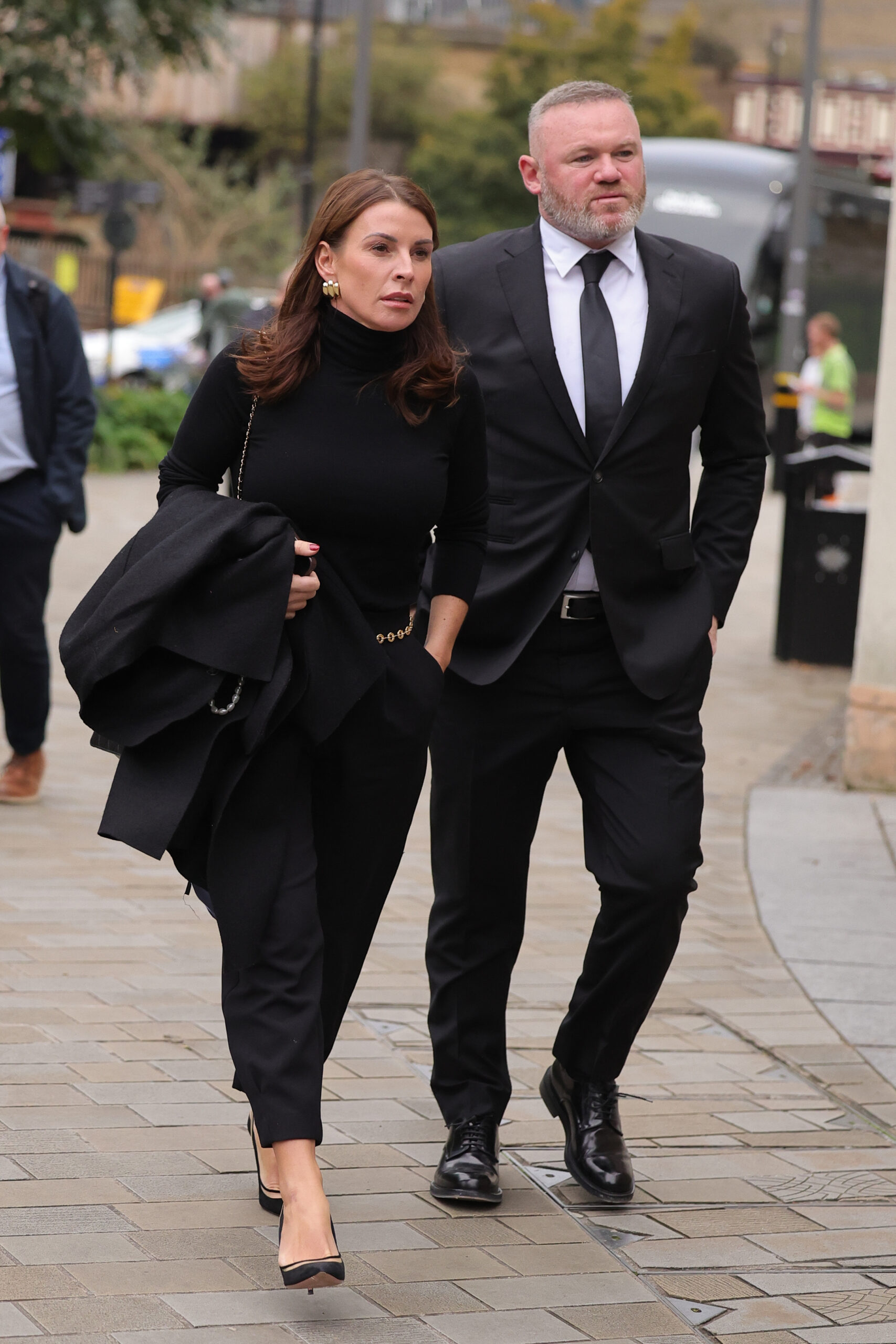 Coleen and Wayne Rooney walking