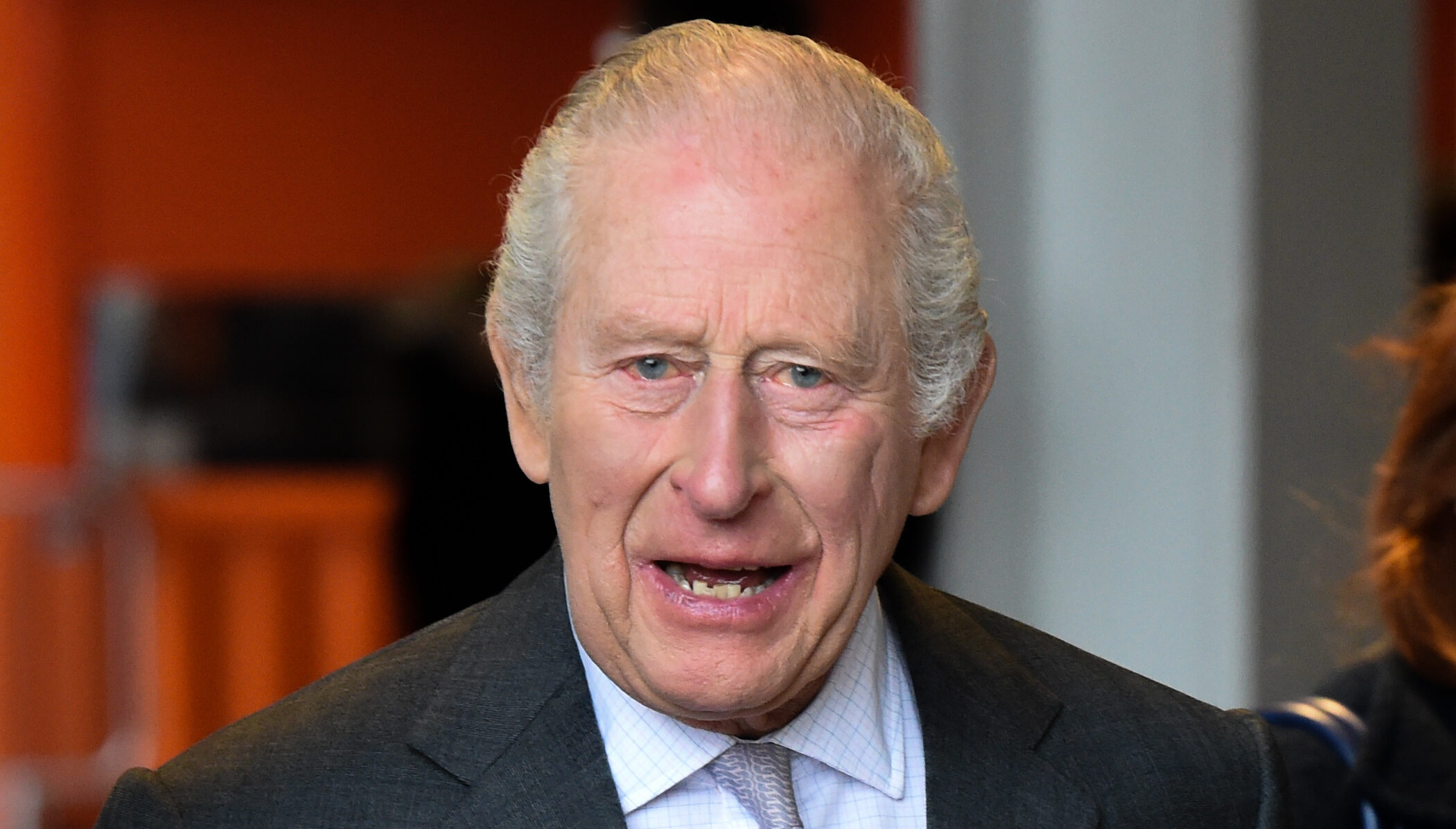 King Charles smiling in suit
