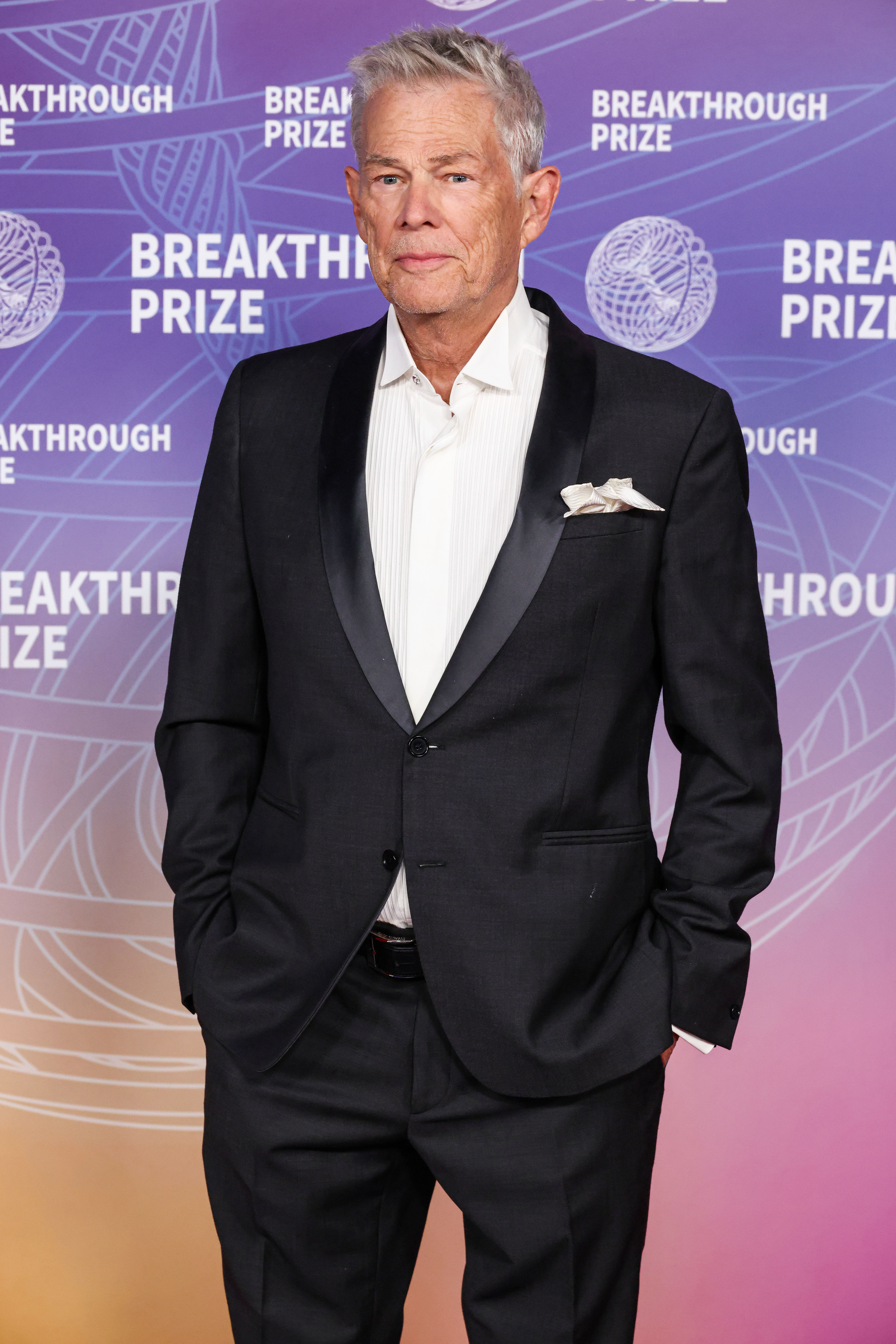 David Foster poses in a suit