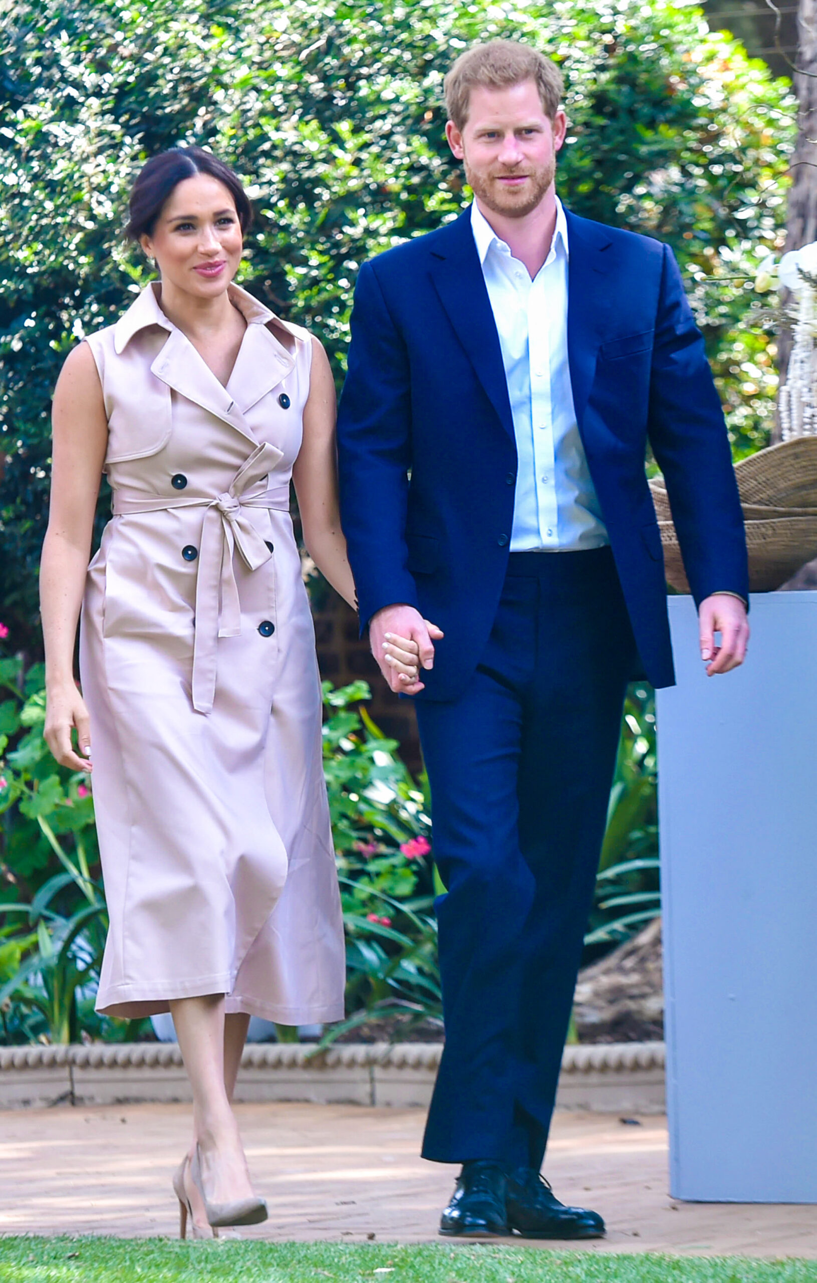 Meghan Markle and Prince Harry walking hold-in-hand
