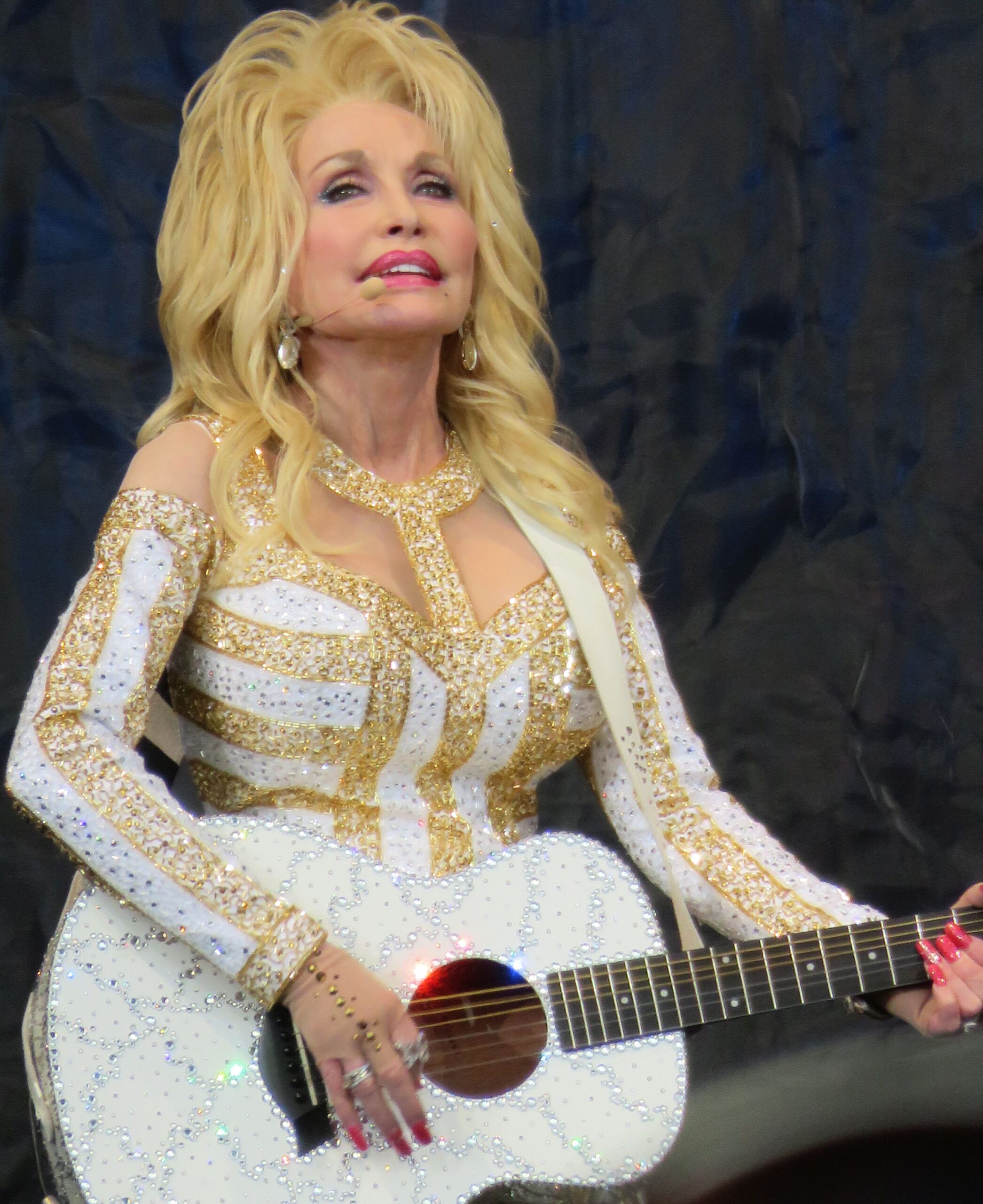 Dolly Parton playing guitar