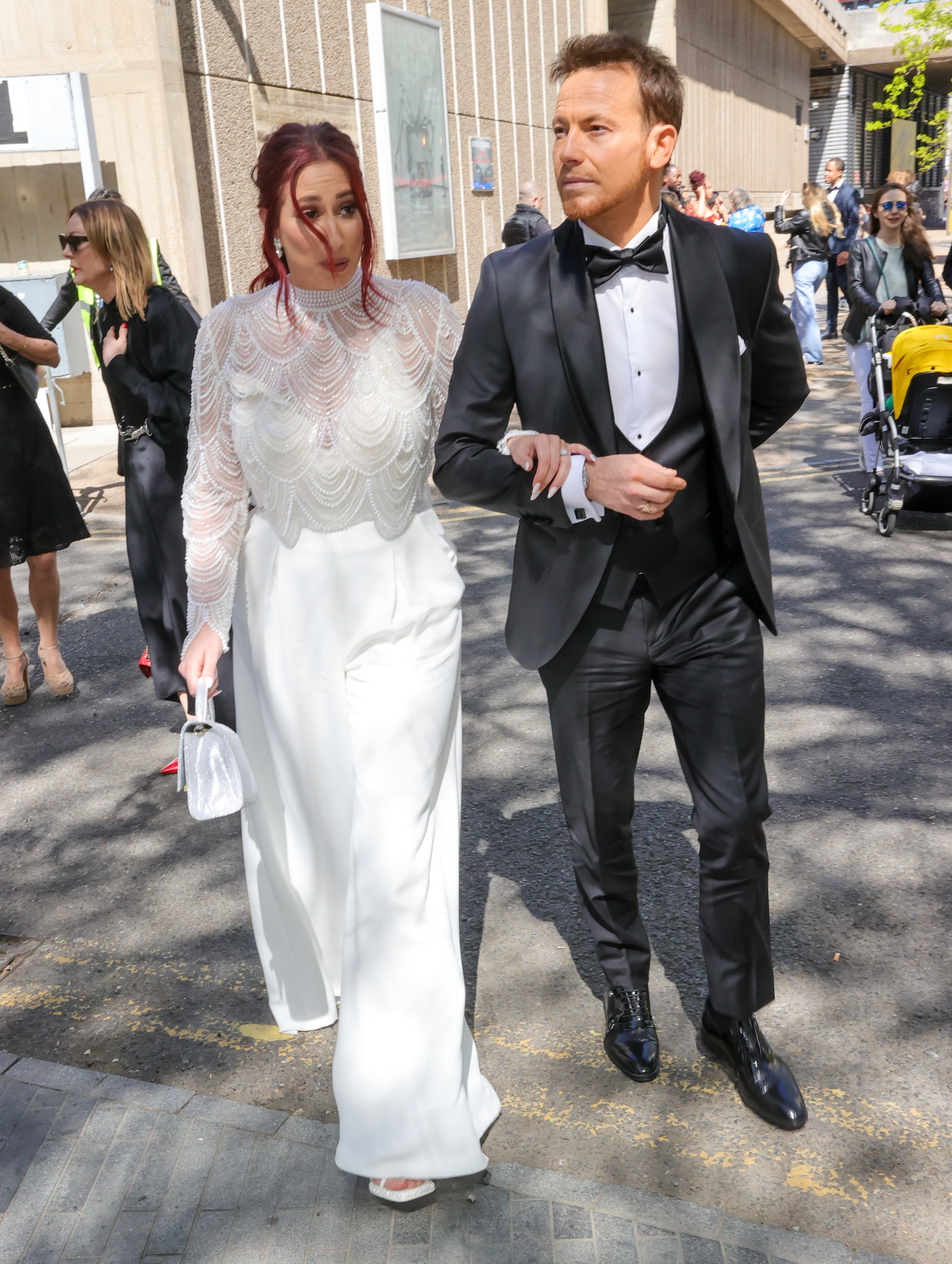 Stacey Solomon and Joe Swash linking arms