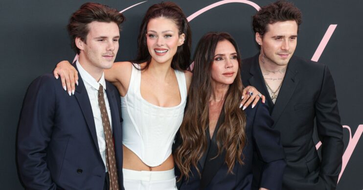 Cruz Beckham poses with Nicola Peltz Beckham, Victoria Beckham and Brooklyn Beckham.