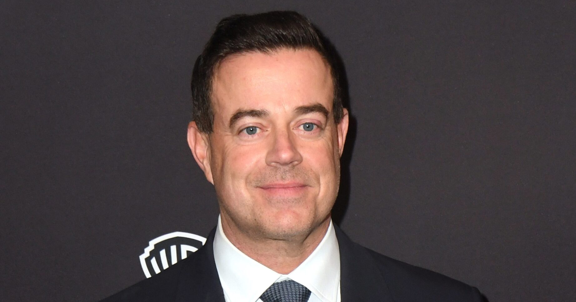 Carson Daly smiling at event