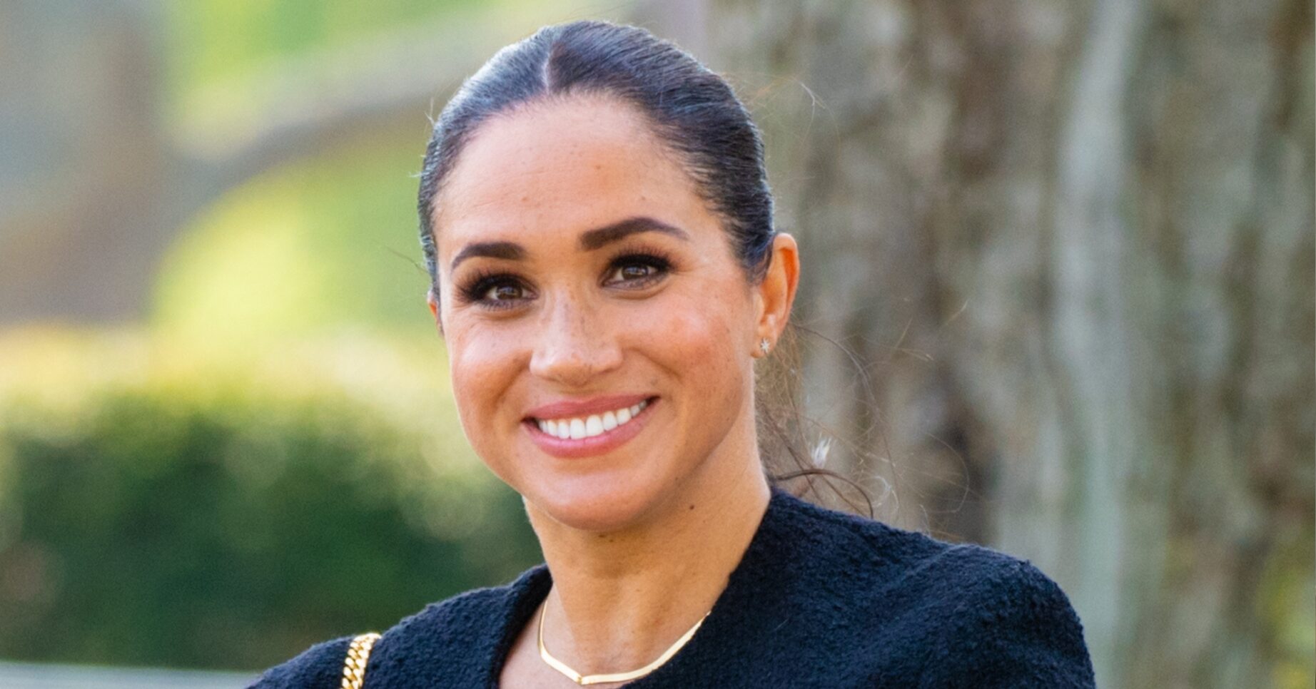 Meghan Markle smiling at camera