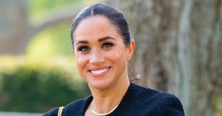 Meghan Markle smiling at camera