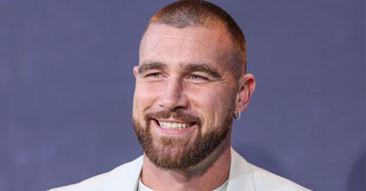 Travis Kelce smiling at event