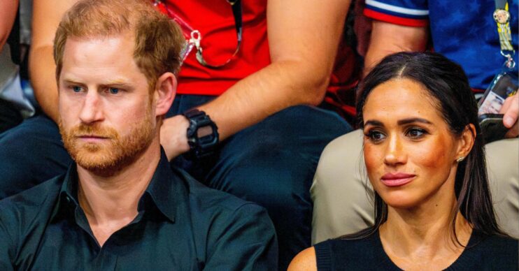 Harry and Meghan frowning