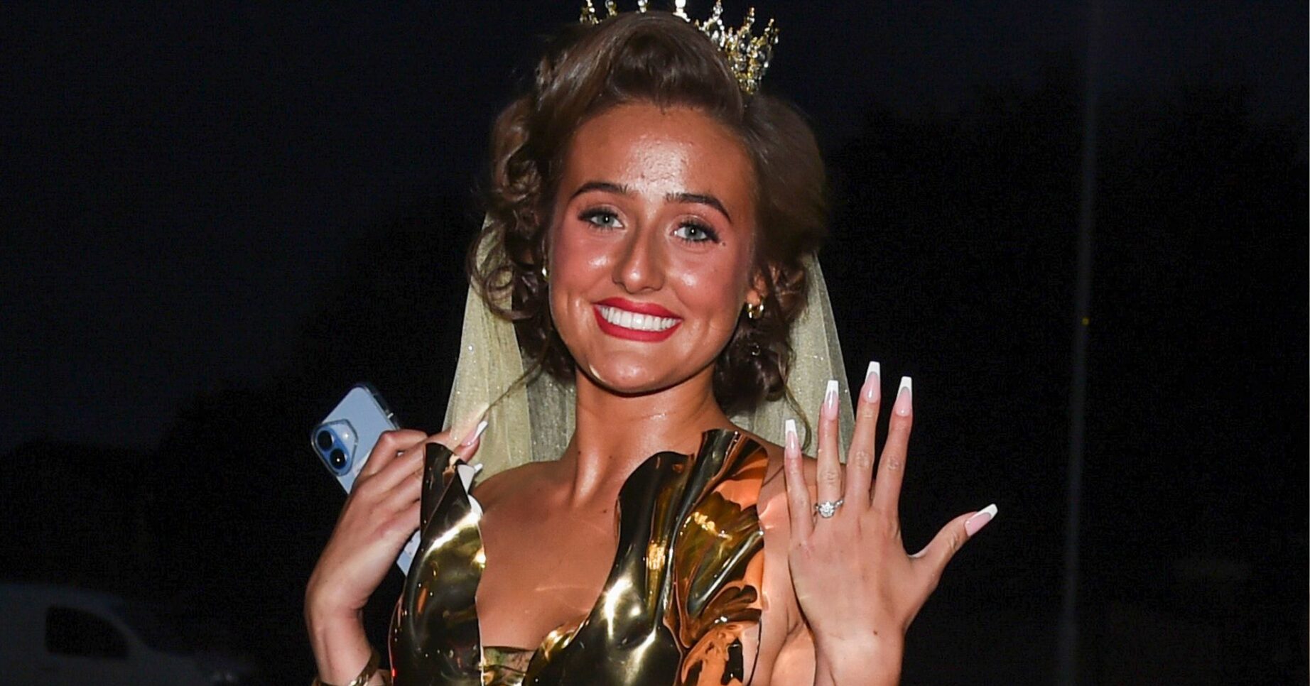 Venezuela Fury holding up her hand and showing off her engagement ring whilst smiling