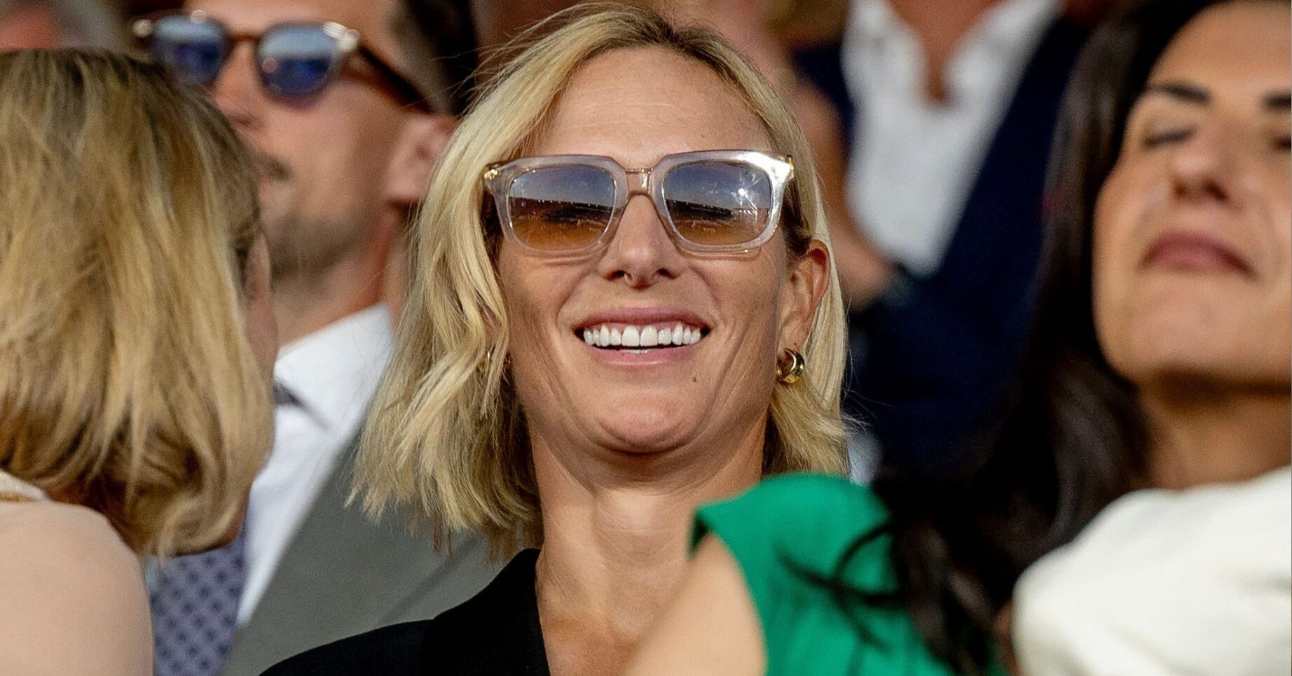 Zara Tindall smiling wearing sunglasses