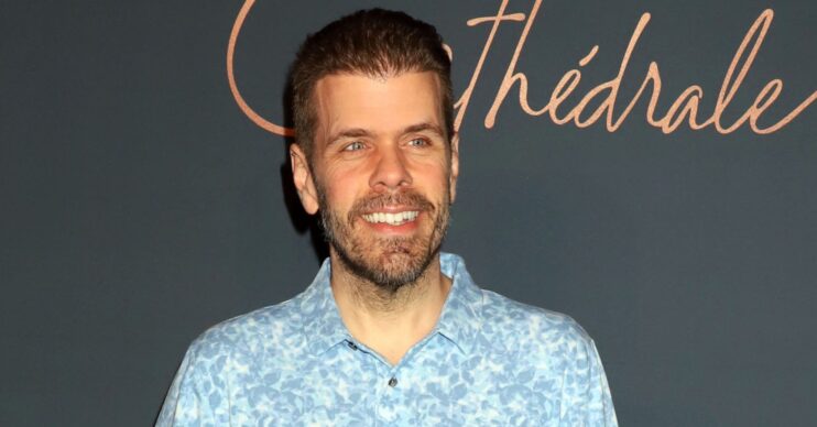 Perez Hilton smiling at event