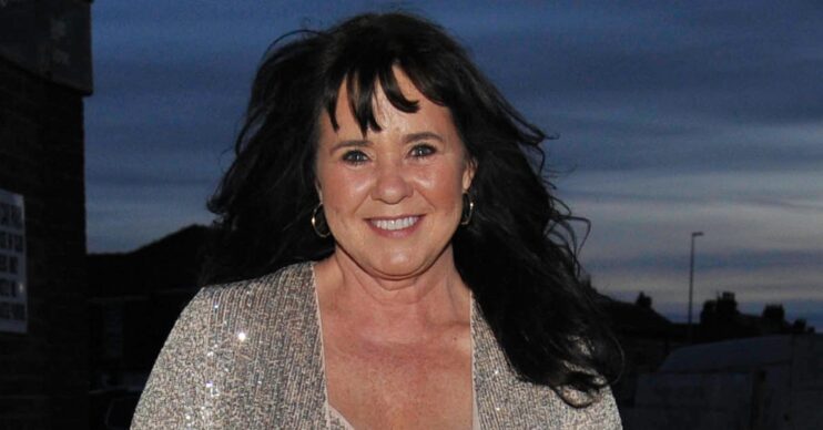 Coleen Nolan smiling in glittery top
