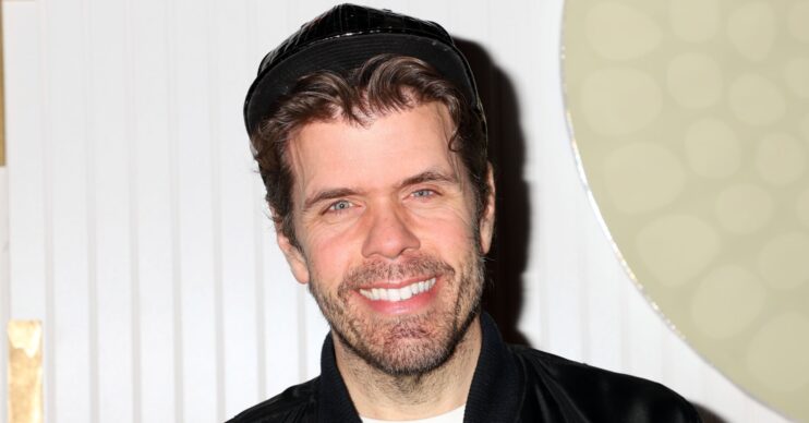 Perez Hilton smiling at event