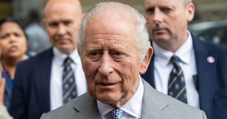King Charles looking concerned in suit