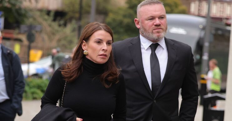 Coleen and Wayne Rooney walking