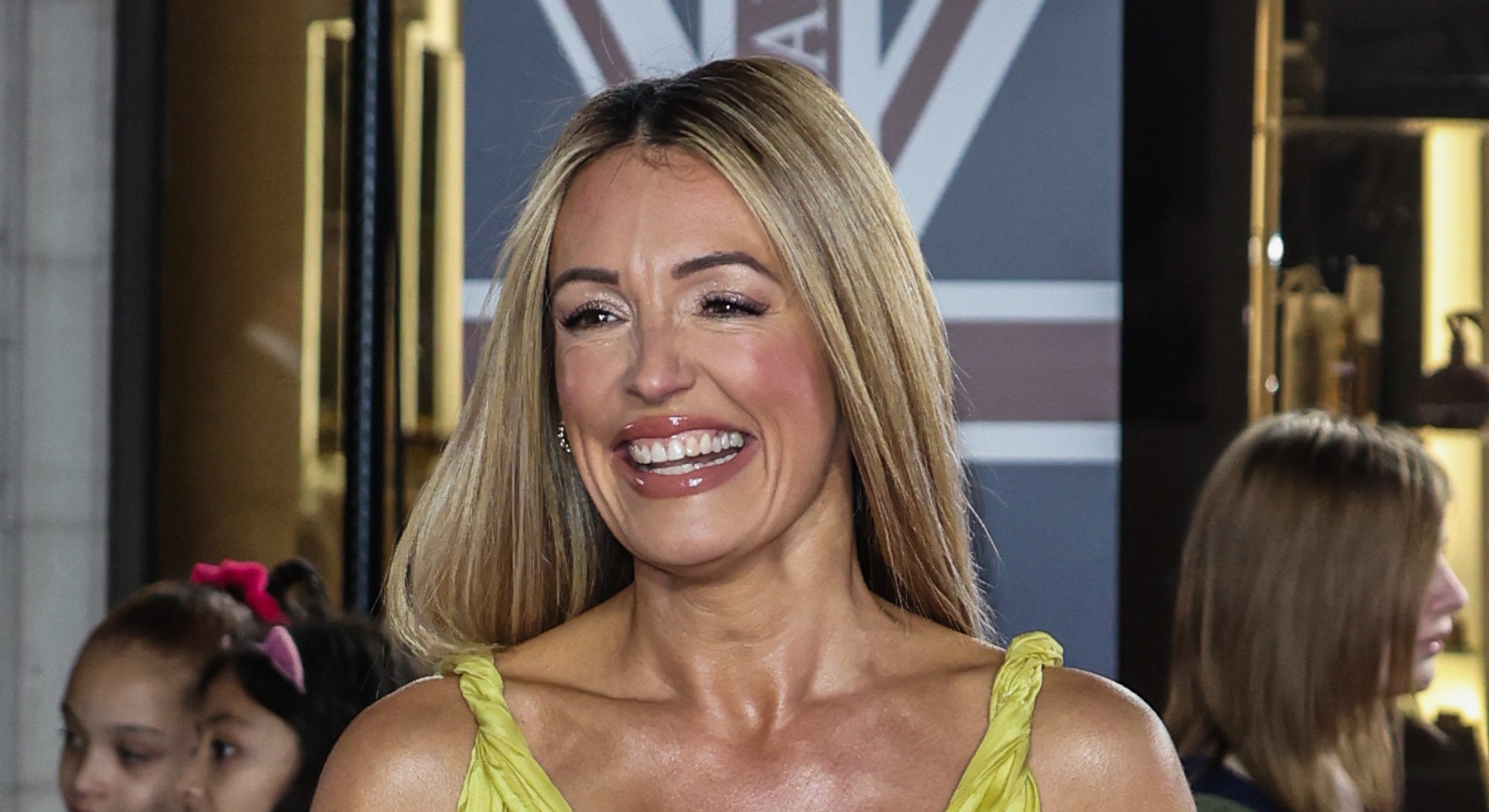 Cat Deeley shows off toned legs in robe on holiday with her children amid rumours she’s ‘dating again’