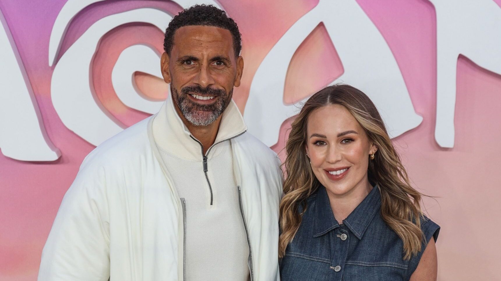 Rio Ferdinand In white suit with wife Kate at Moana premiere