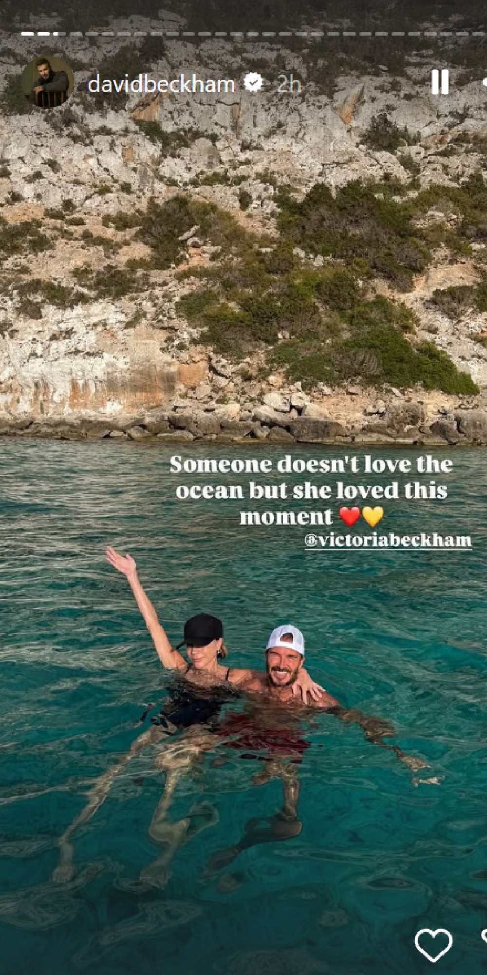David and Victoria Beckham in the ocean