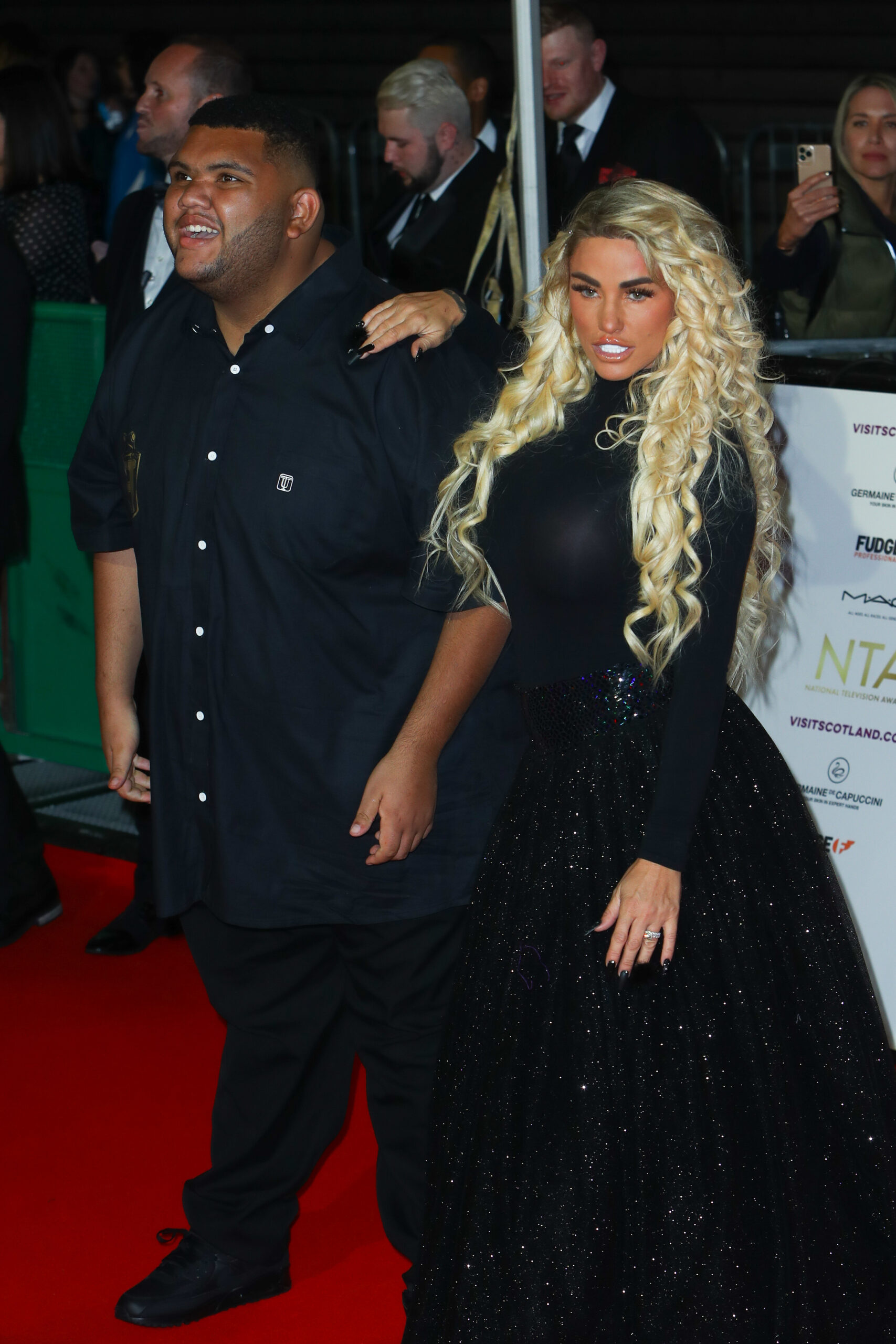 Katie Price poses on the red carpet with her son Harvey
