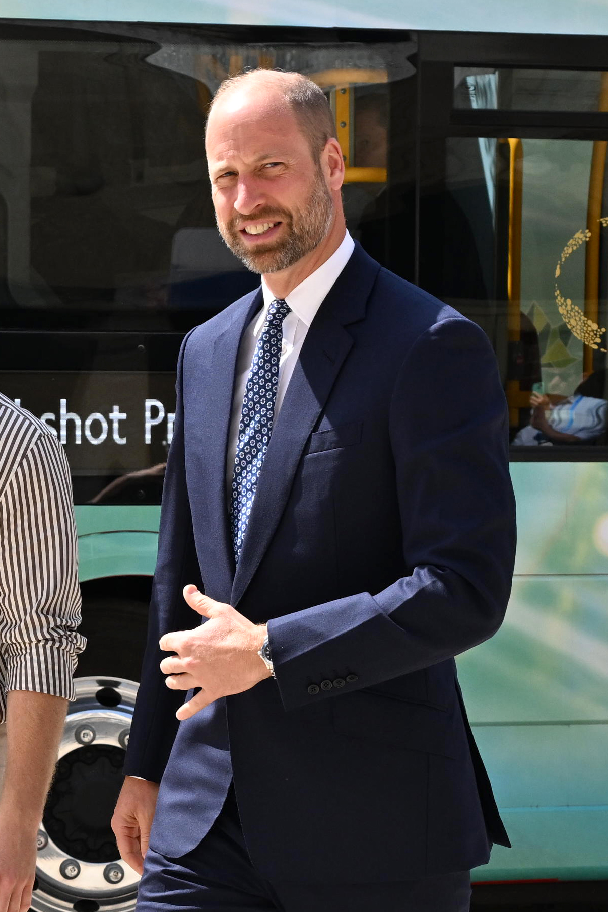 Prince William smiling in blue suit