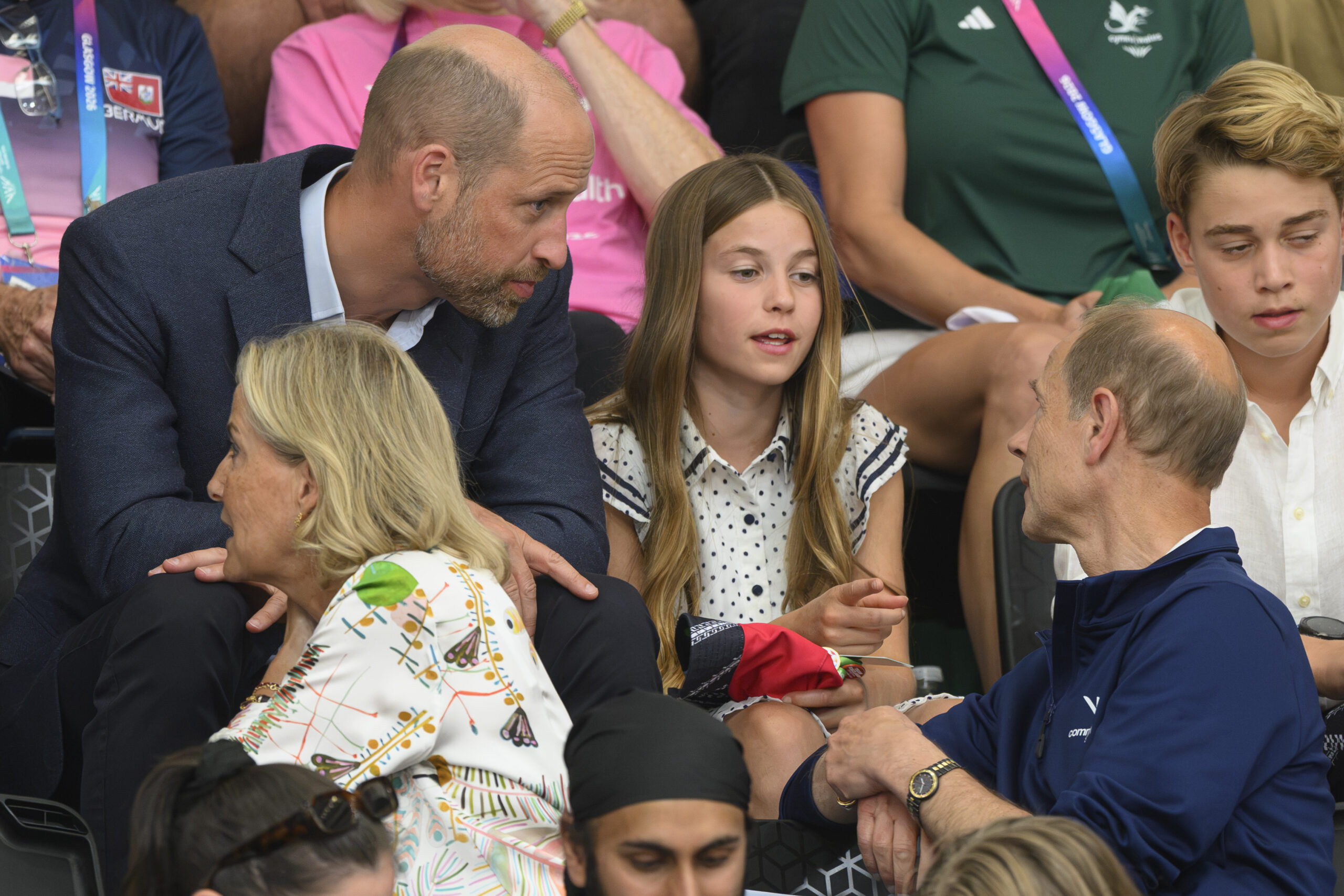 Prince William and Princess Charlotte talking to Prince Edward at Commonwealth Games