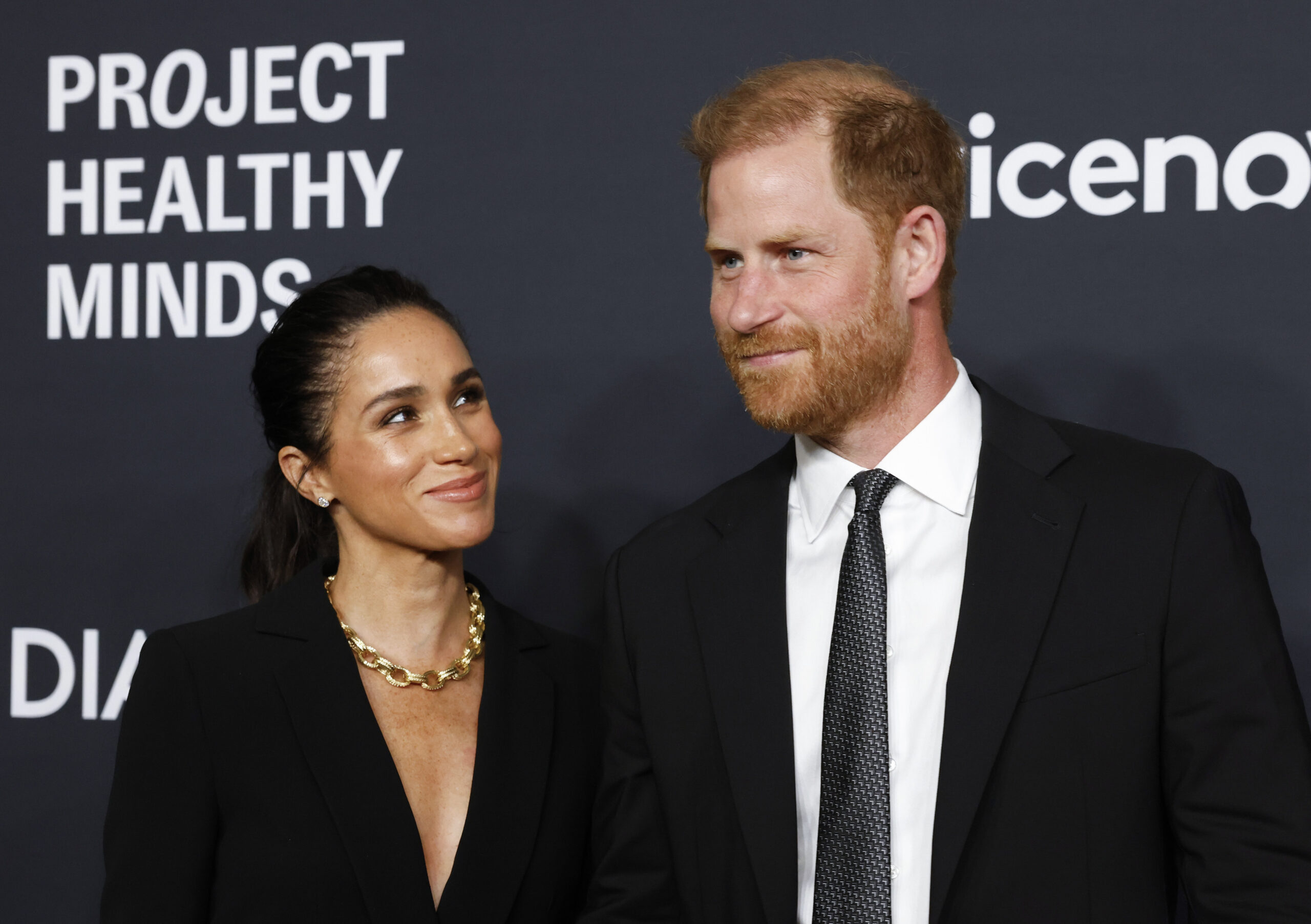 Meghan Markle looking at Prince Harry at World Mental Health Day