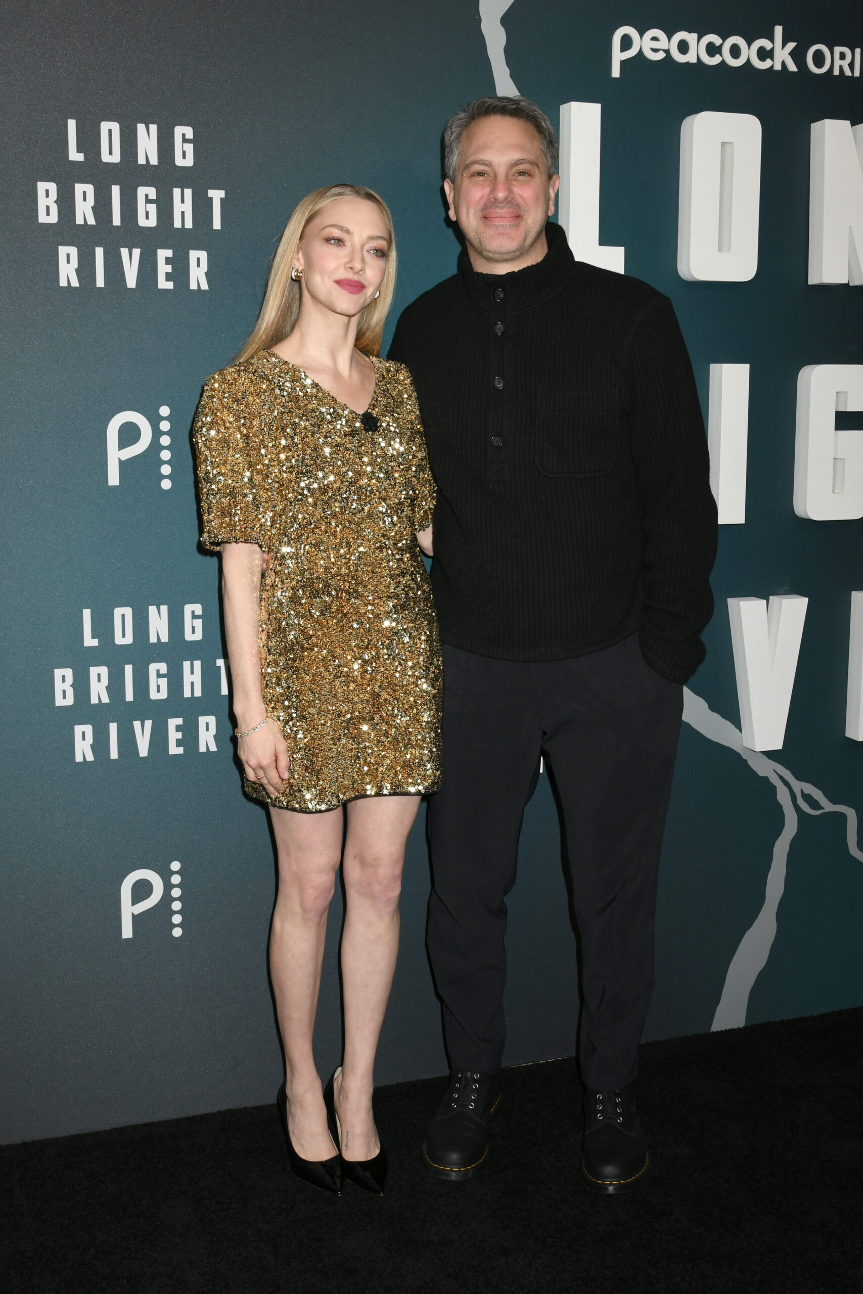 Amanda Seyfried and Thomas Sadoski pose on the red carpet